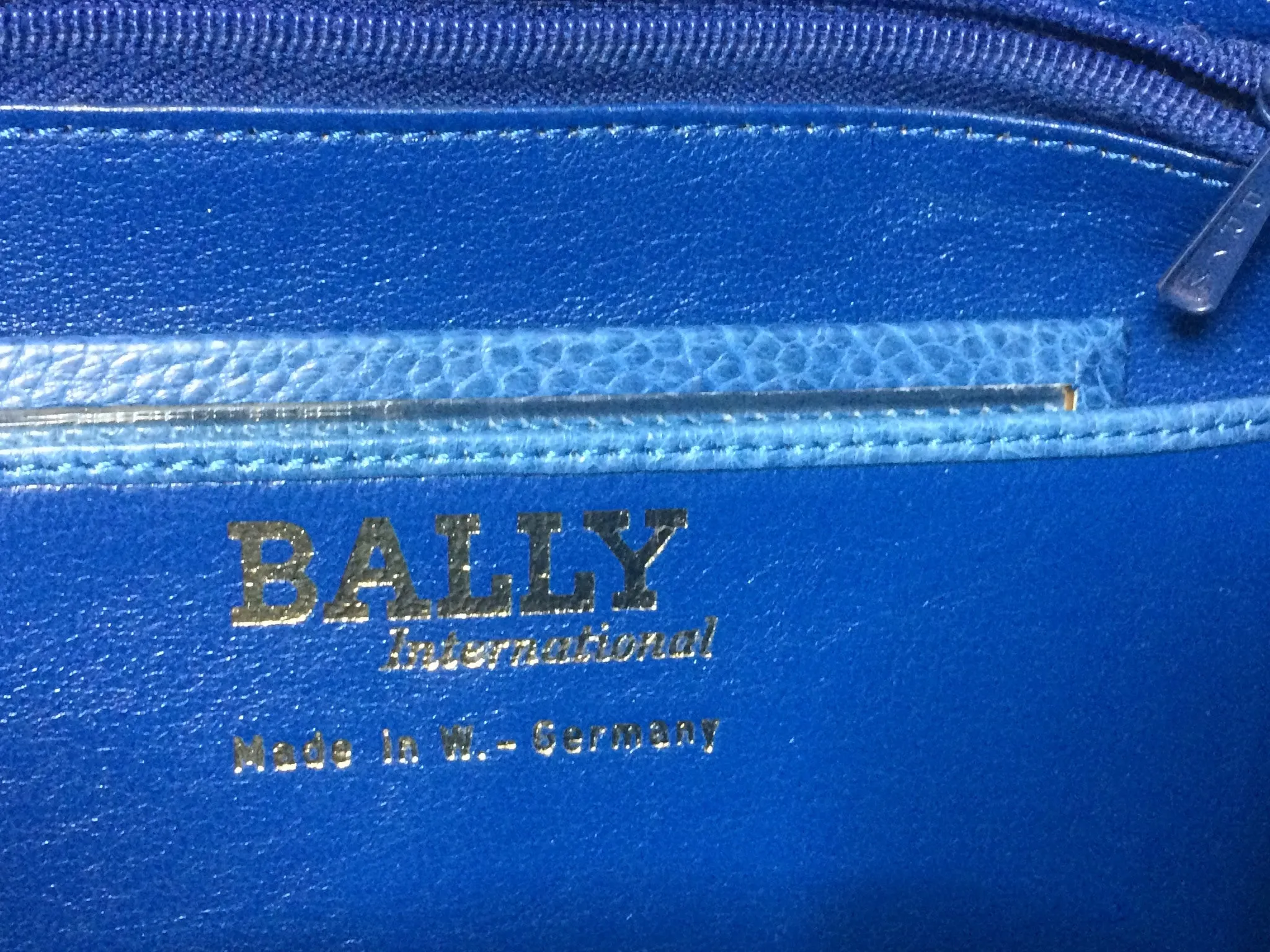 1980s. Vintage BALLY genuine blue ostrich leather shoulder bag with gathered knot, bow design and black motif. Made in W. Germany. 050406r3