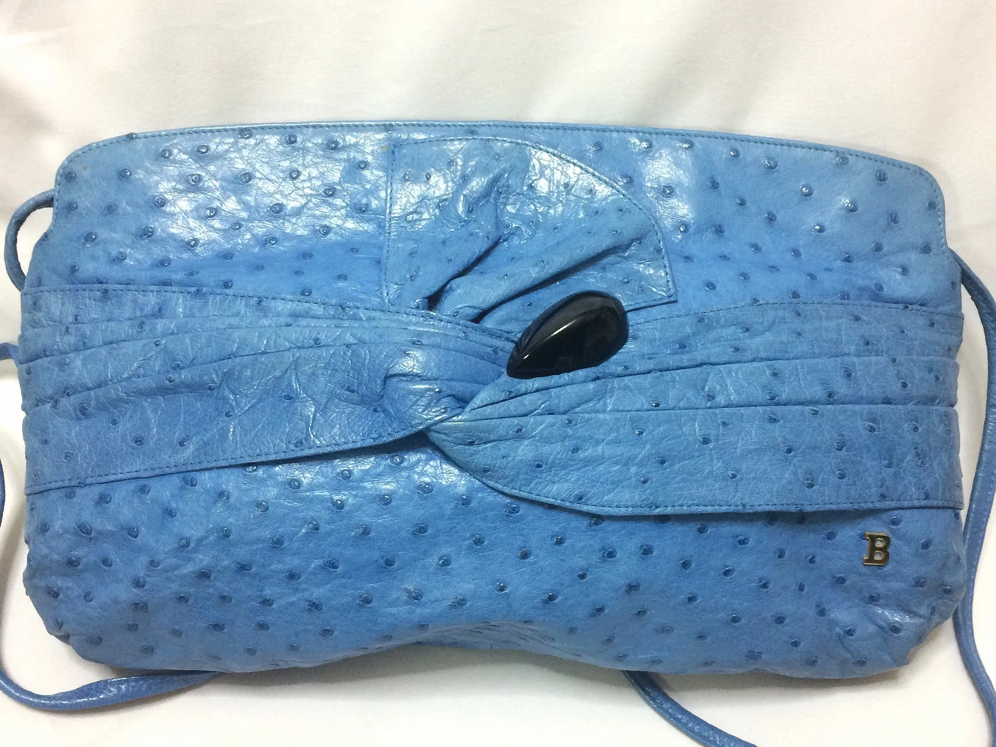 1980s. Vintage BALLY genuine blue ostrich leather shoulder bag with gathered knot, bow design and black motif. Made in W. Germany. 050406r3
