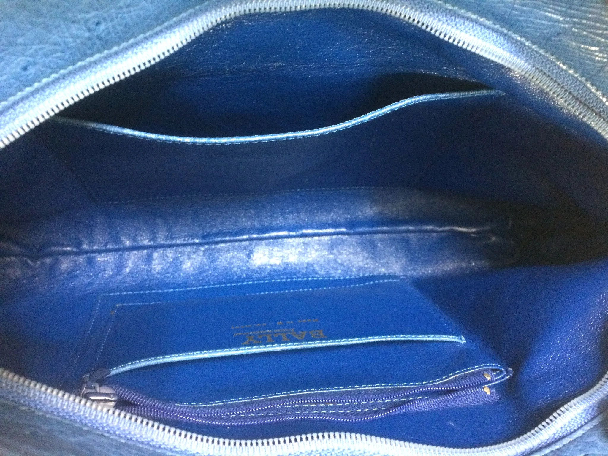 1980s. Vintage BALLY genuine blue ostrich leather shoulder bag with gathered knot, bow design and black motif. Made in W. Germany. 050406r3