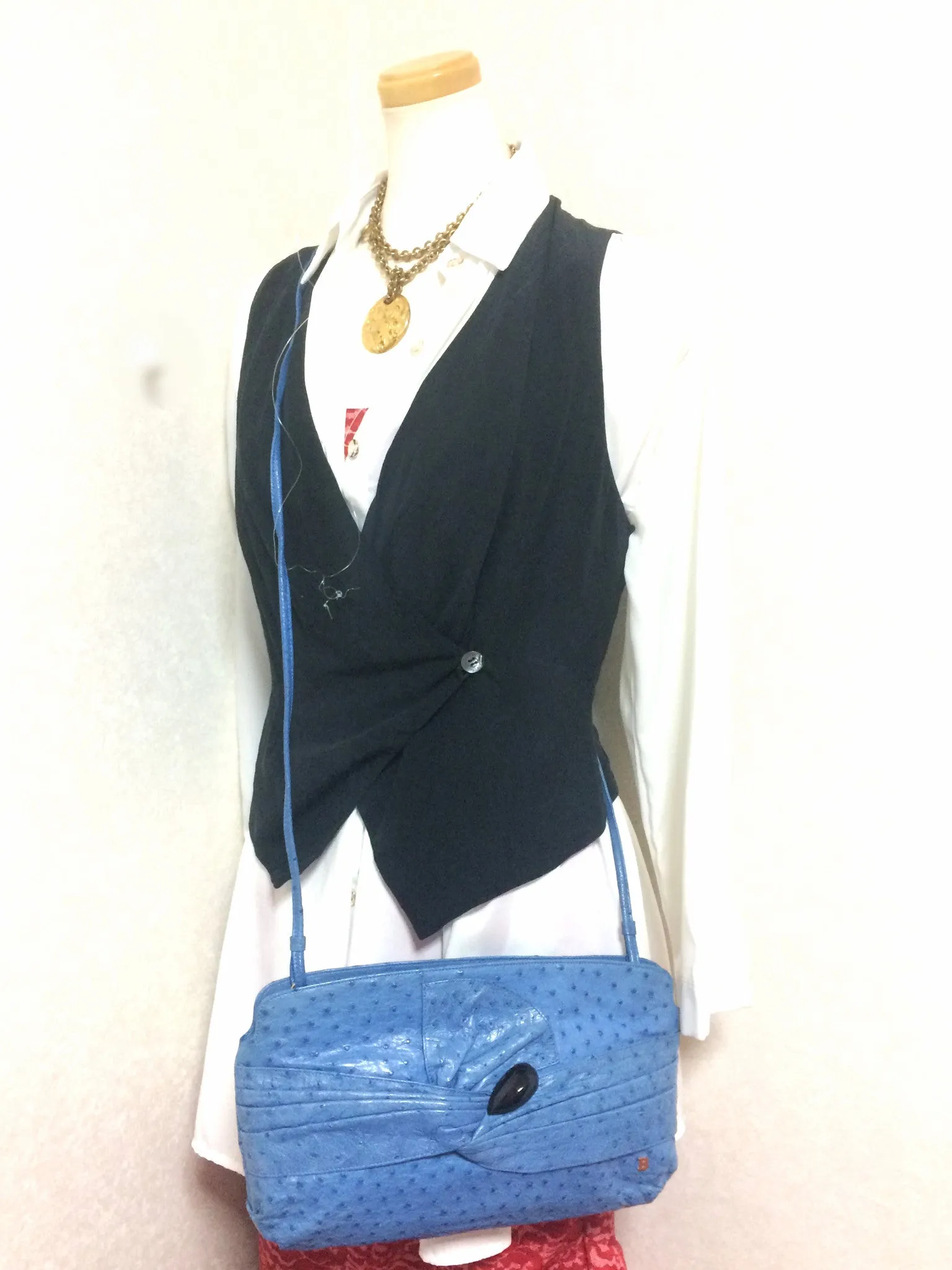 1980s. Vintage BALLY genuine blue ostrich leather shoulder bag with gathered knot, bow design and black motif. Made in W. Germany. 050406r3