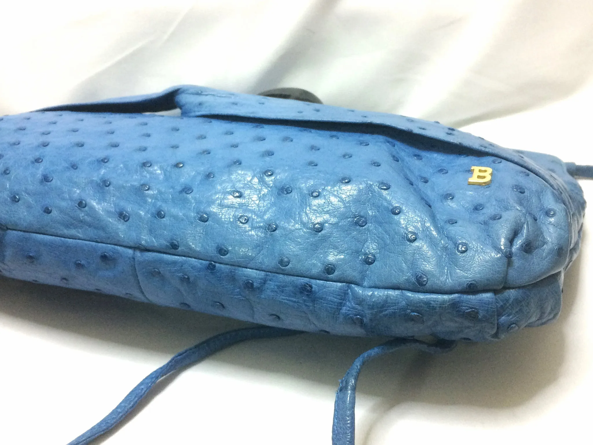 1980s. Vintage BALLY genuine blue ostrich leather shoulder bag with gathered knot, bow design and black motif. Made in W. Germany. 050406r3