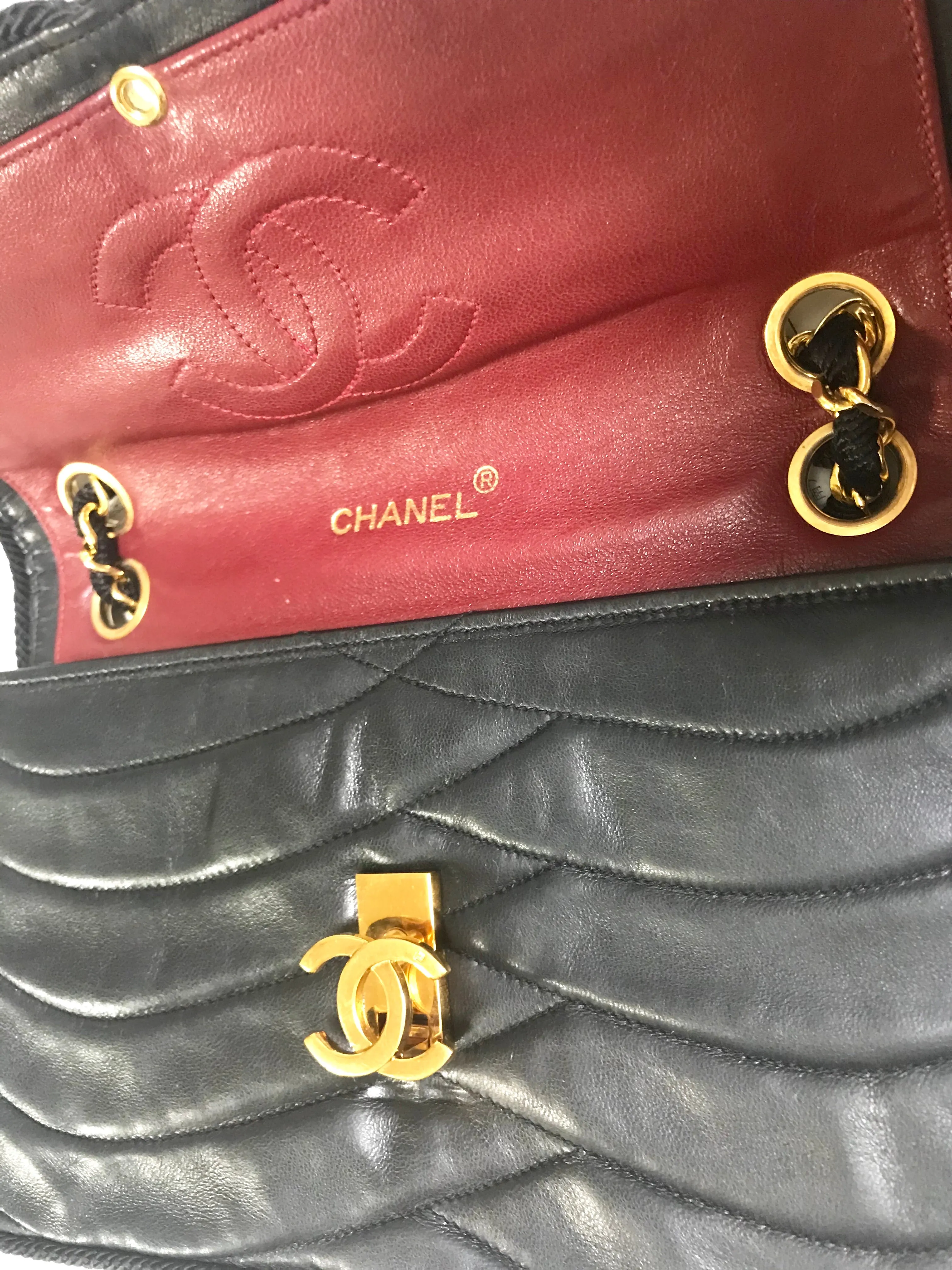 80's vintage Chanel black 2.55 shoulder bag with wavy stitches and rope strings and gold chain strap. Very rare piece from the era