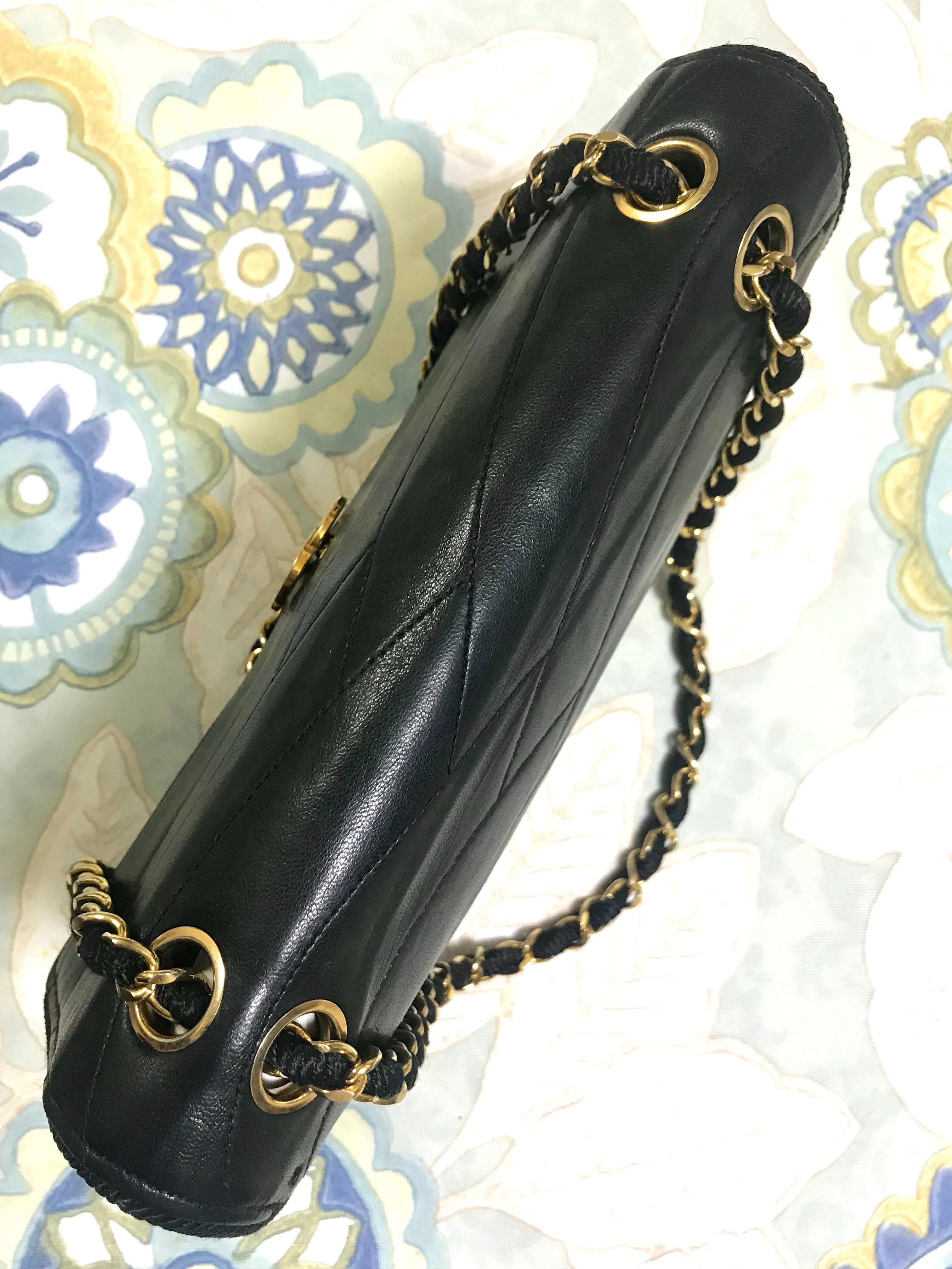 80's vintage Chanel black 2.55 shoulder bag with wavy stitches and rope strings and gold chain strap. Very rare piece from the era