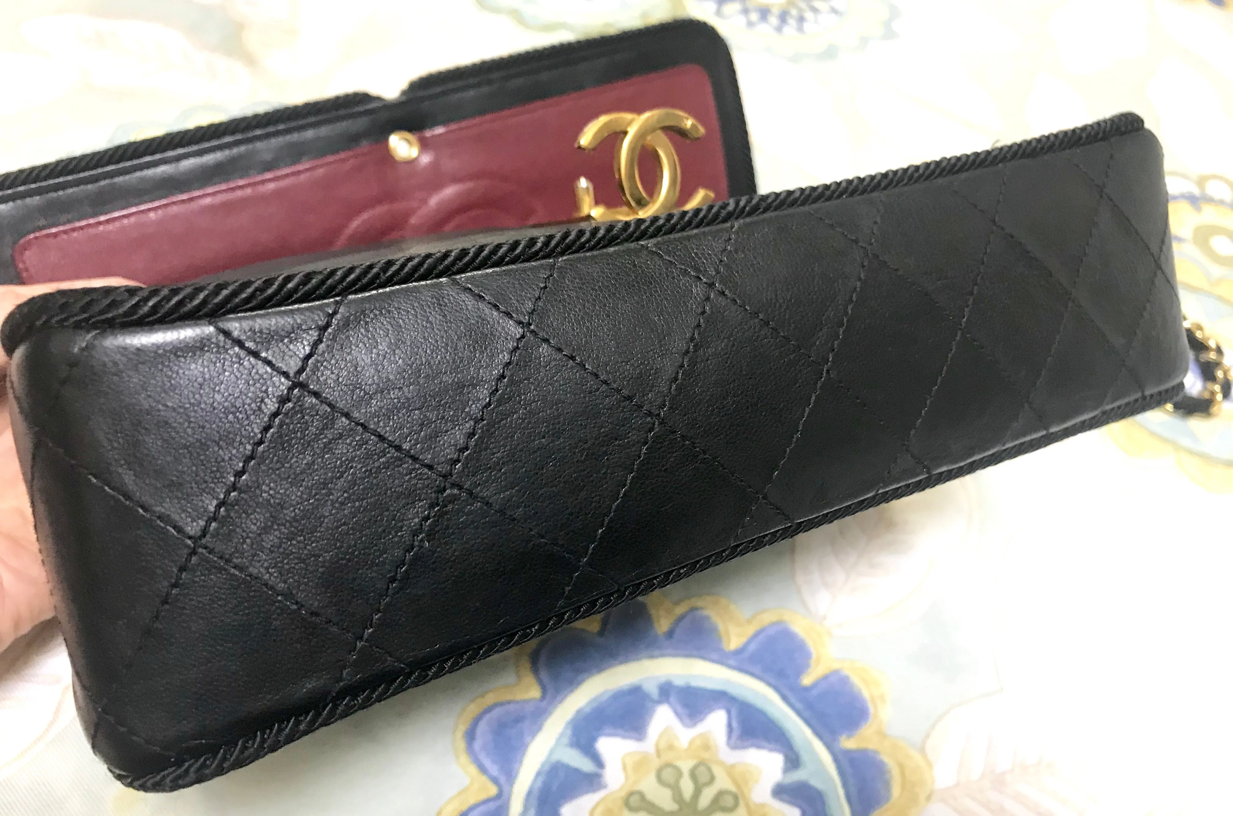 80's vintage Chanel black 2.55 shoulder bag with wavy stitches and rope strings and gold chain strap. Very rare piece from the era