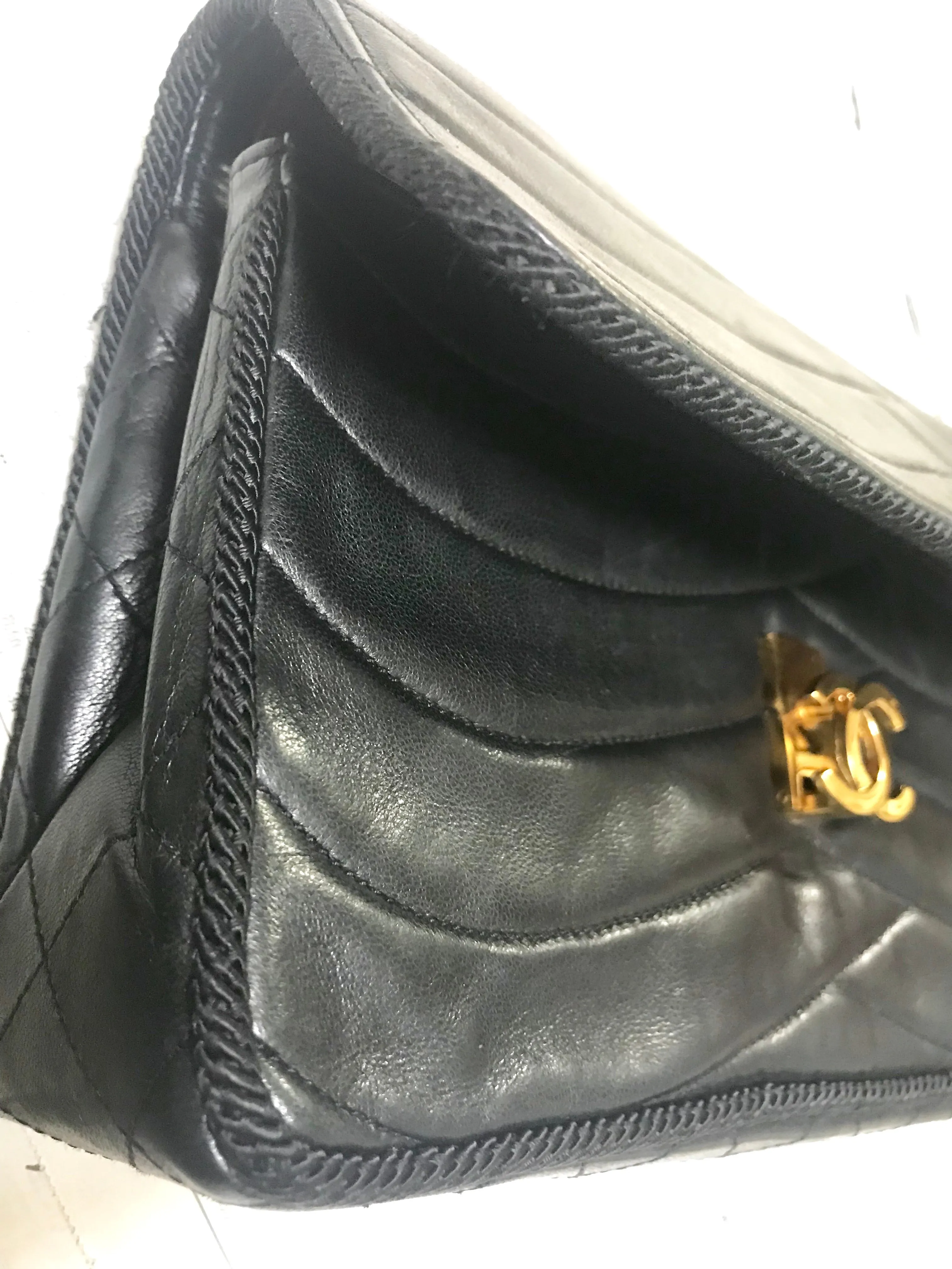 80's vintage Chanel black 2.55 shoulder bag with wavy stitches and rope strings and gold chain strap. Very rare piece from the era