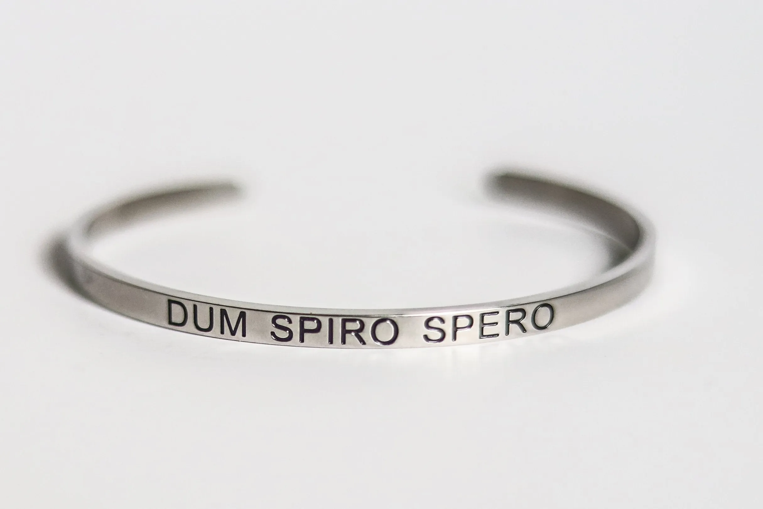 Engraved stainless steel cuffs.