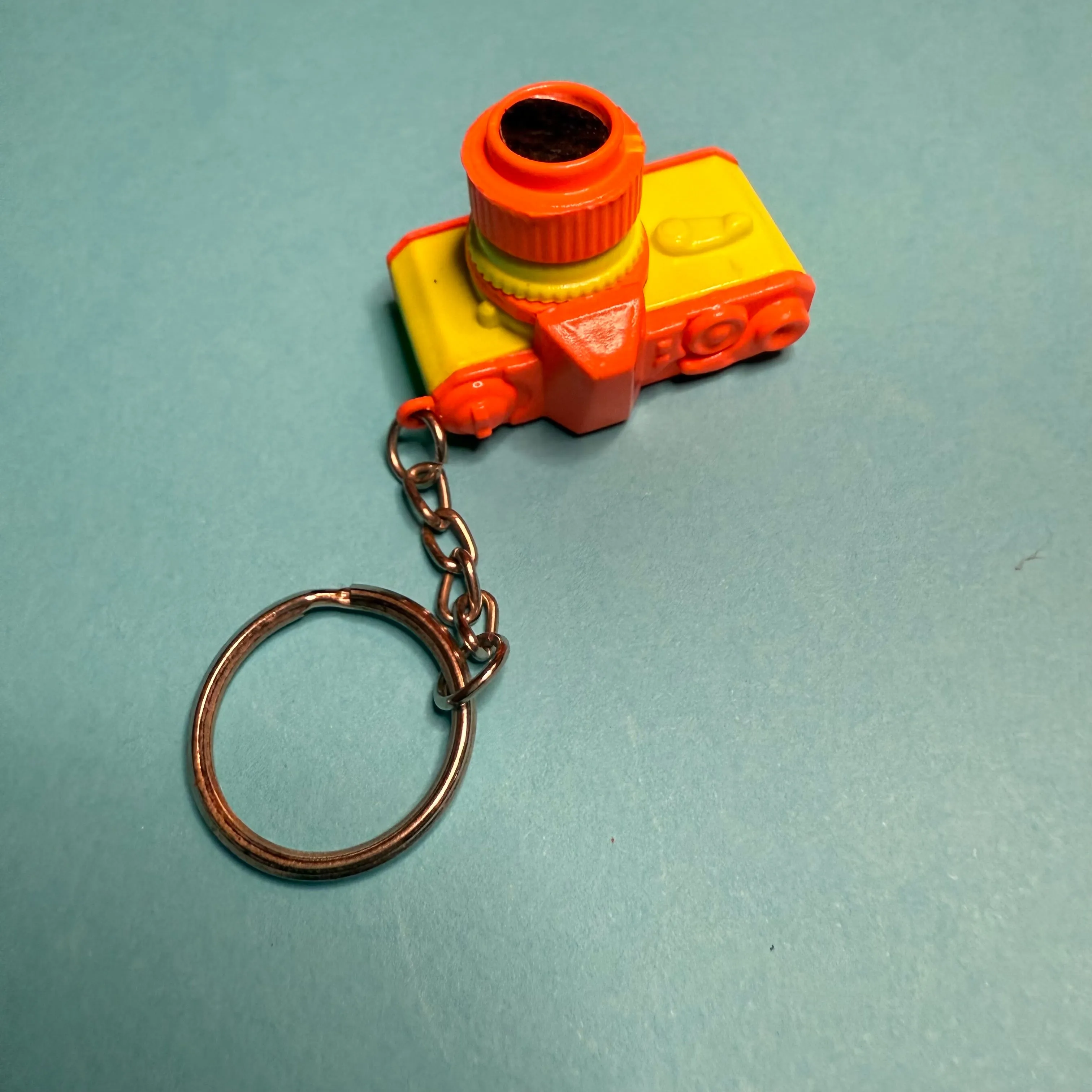 Neon 80s mini orange yellow camera charm keyring