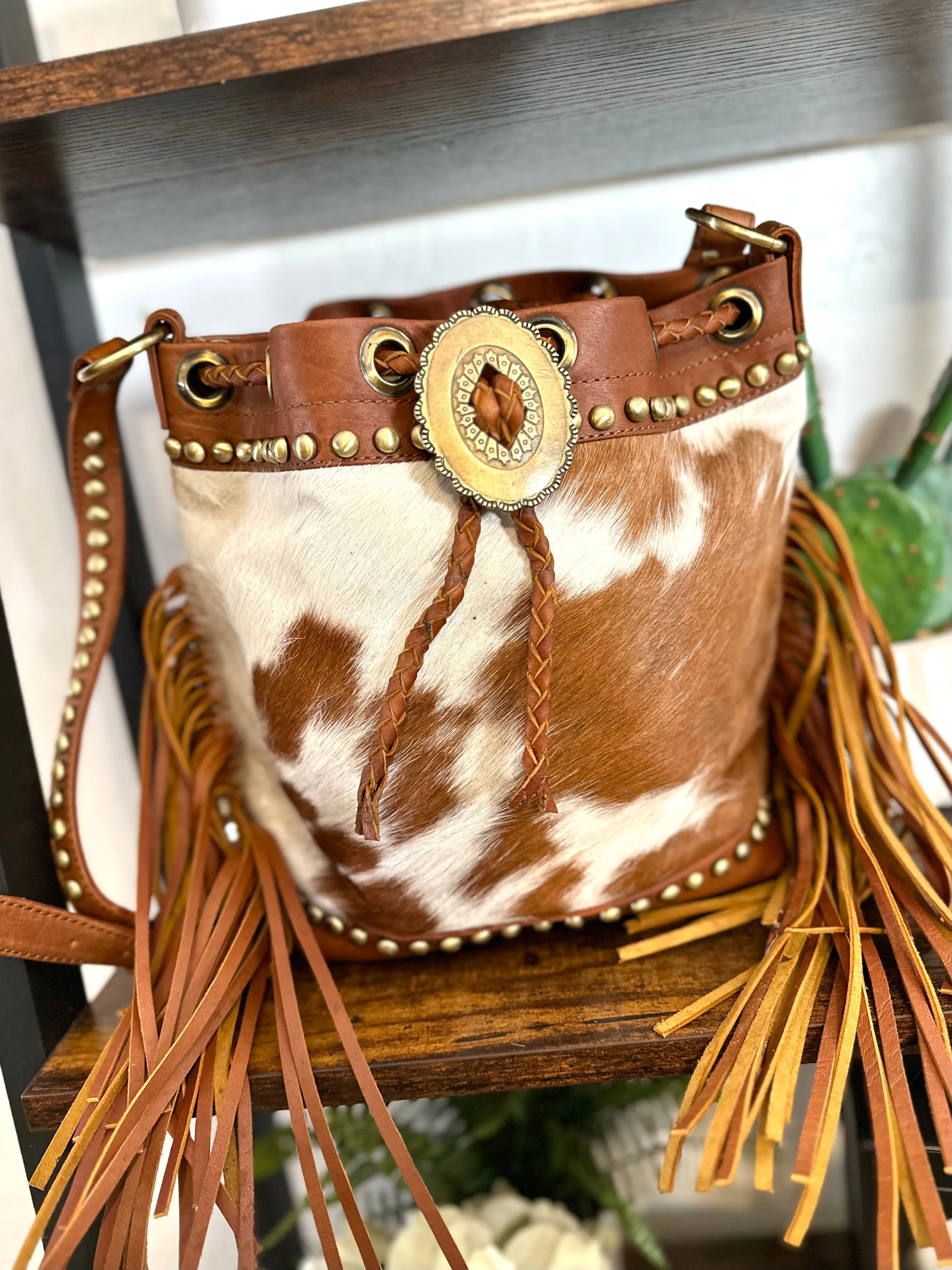 Tan Cowhide and Leather Bolo Tie Bucket Style Handbag