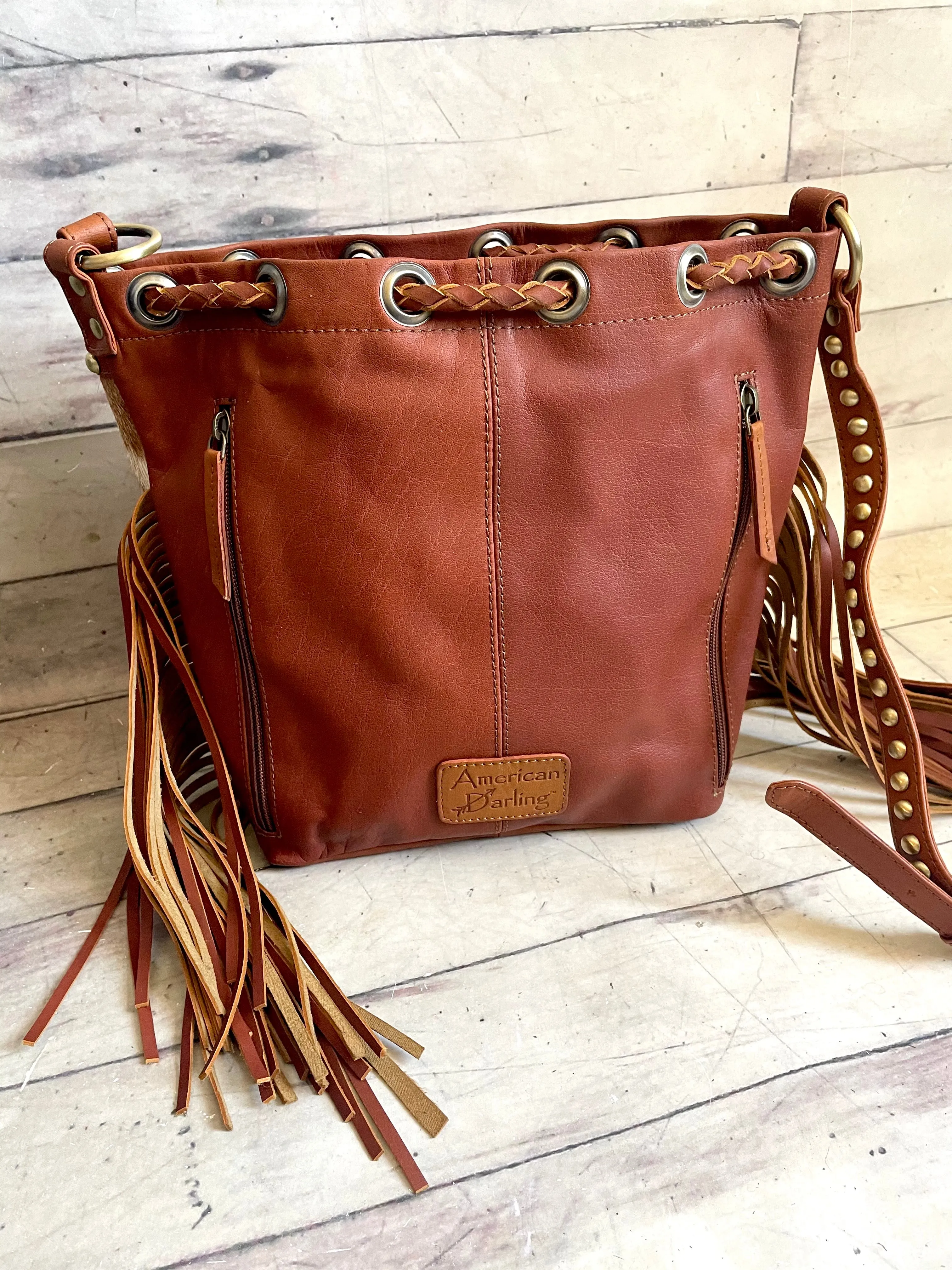 Tan Cowhide and Leather Bolo Tie Bucket Style Handbag