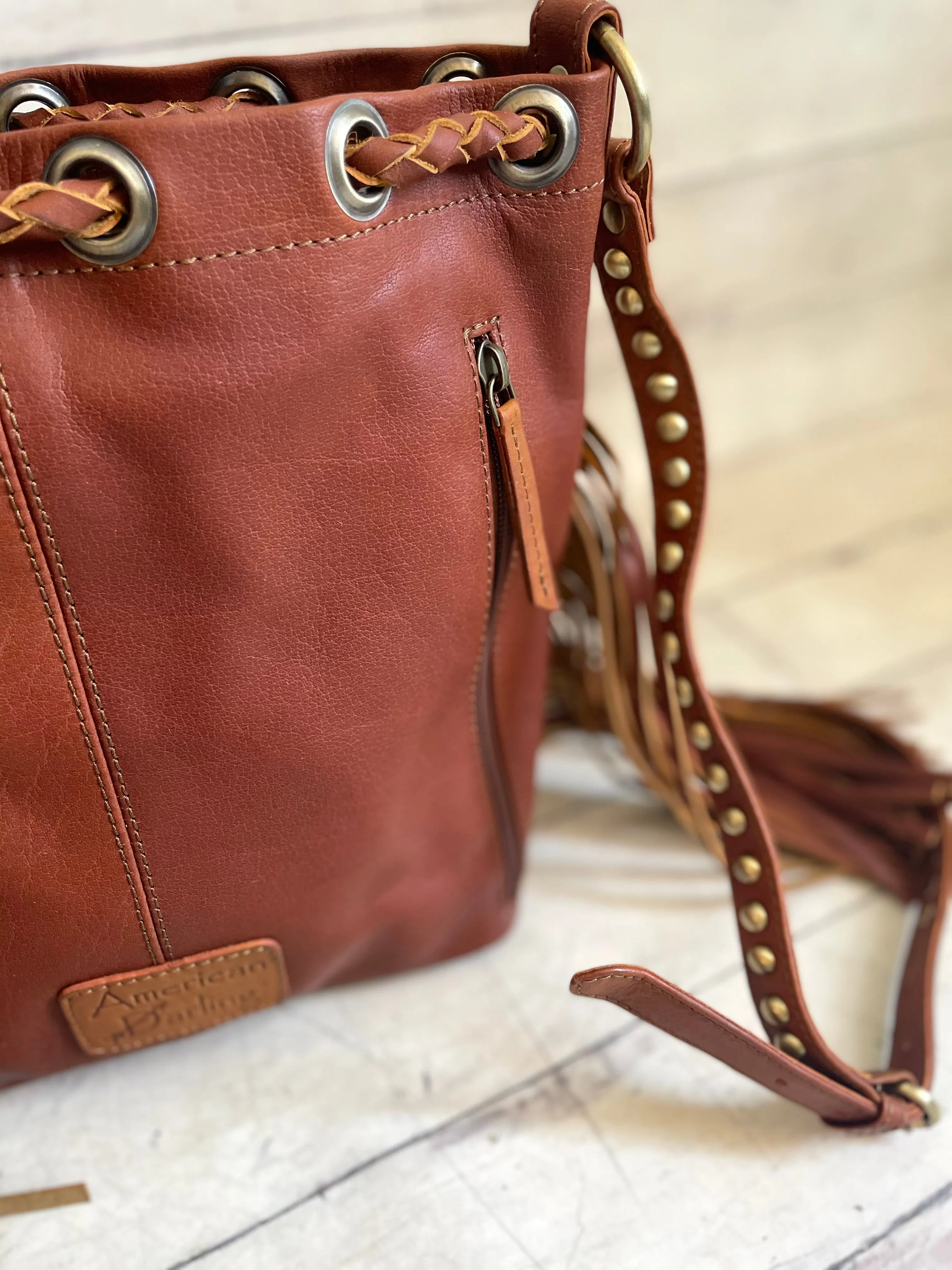Tan Cowhide and Leather Bolo Tie Bucket Style Handbag