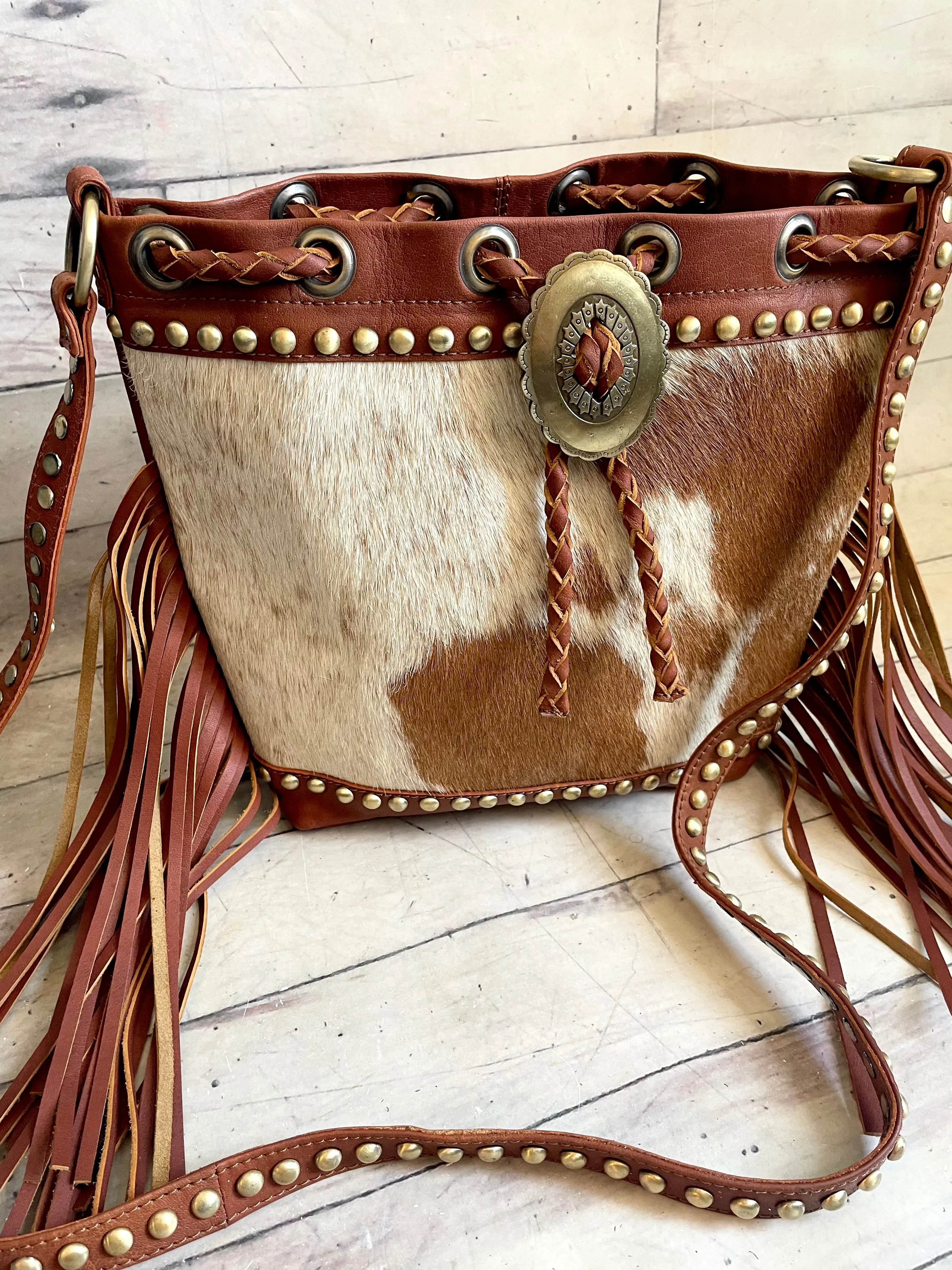 Tan Cowhide and Leather Bolo Tie Bucket Style Handbag