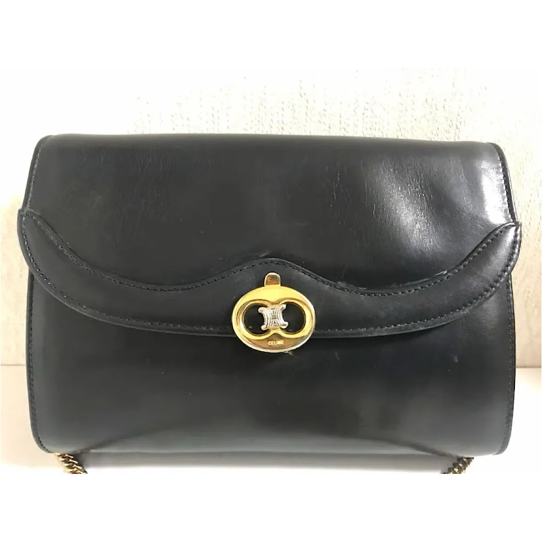 Vintage CELINE genuine black leather shoulder bag with gold and silver tone triomphe logo motif at front. Rare Celine leather bag.