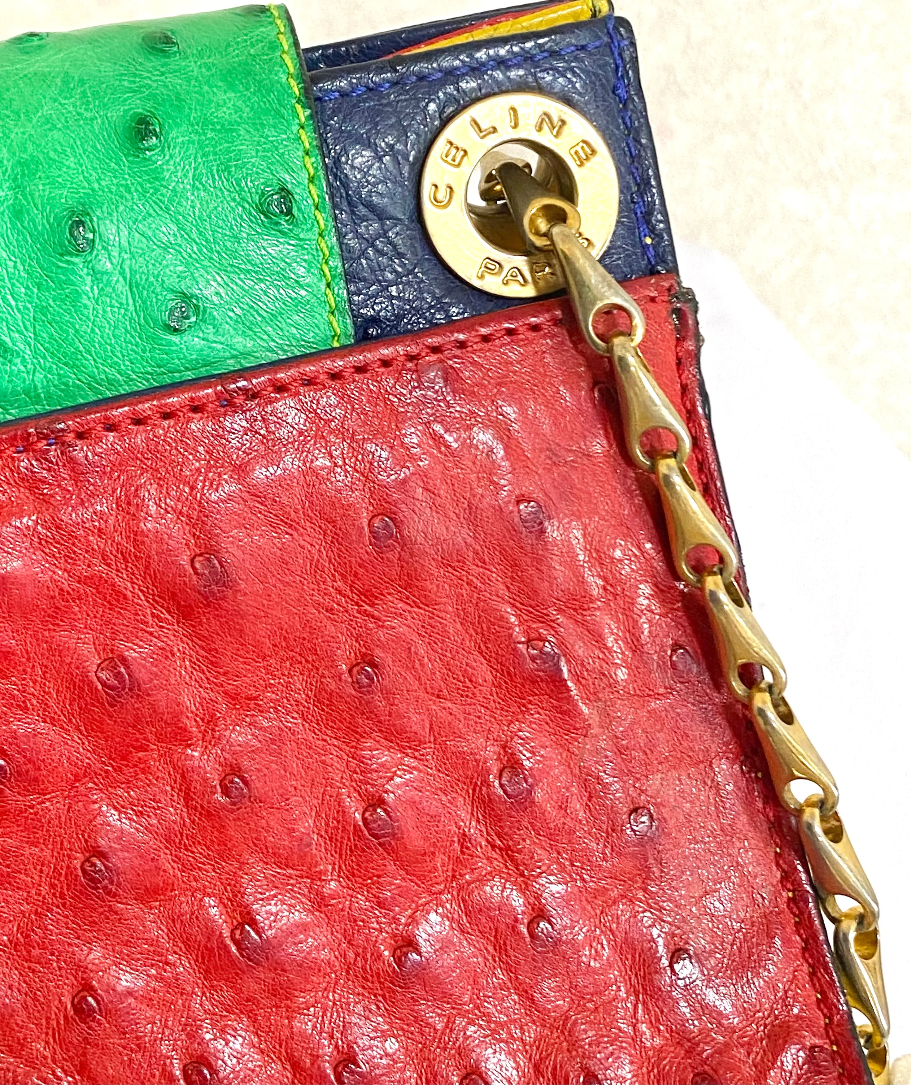 Vintage Celine genuine ostrich shoulder bag with gold tone chains and red, orange, blue, green, and yellow patchwork design. 050410ac1