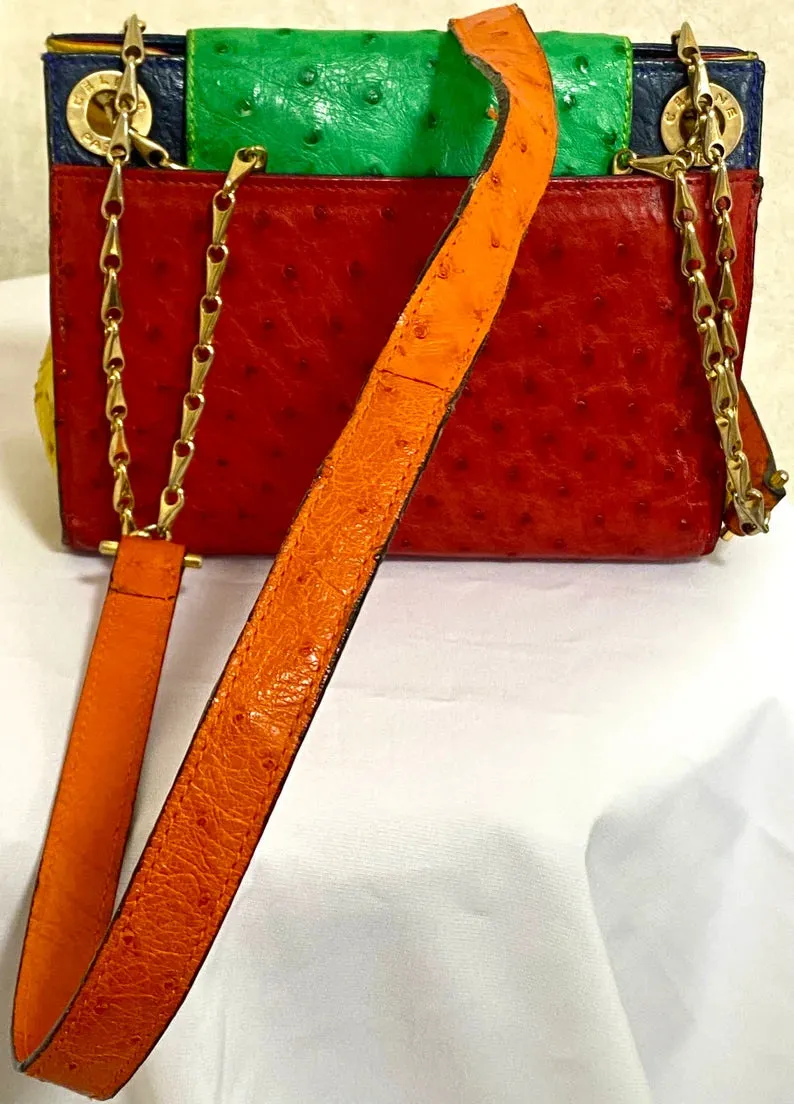Vintage Celine genuine ostrich shoulder bag with gold tone chains and red, orange, blue, green, and yellow patchwork design. 050410ac1