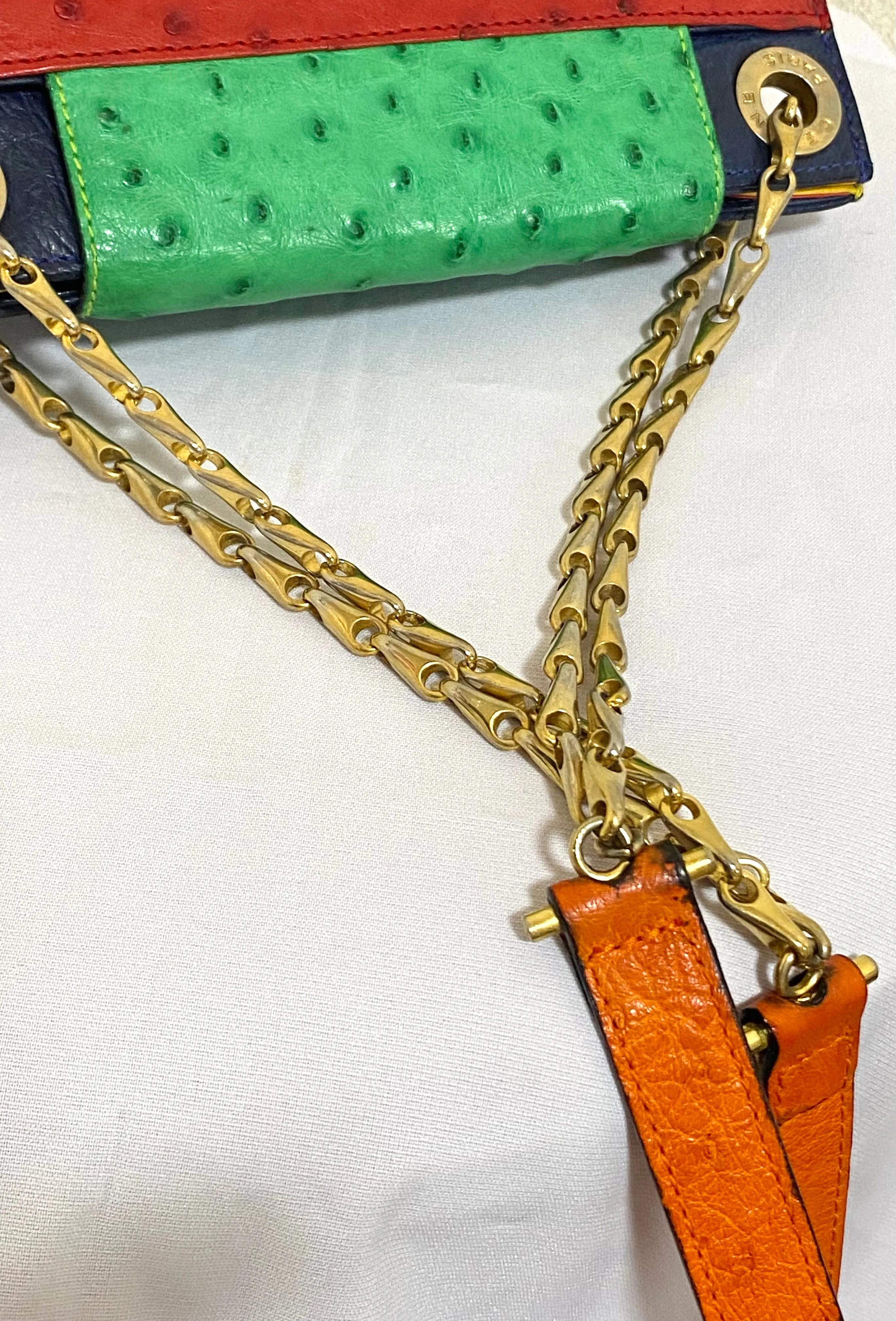 Vintage Celine genuine ostrich shoulder bag with gold tone chains and red, orange, blue, green, and yellow patchwork design. 050410ac1
