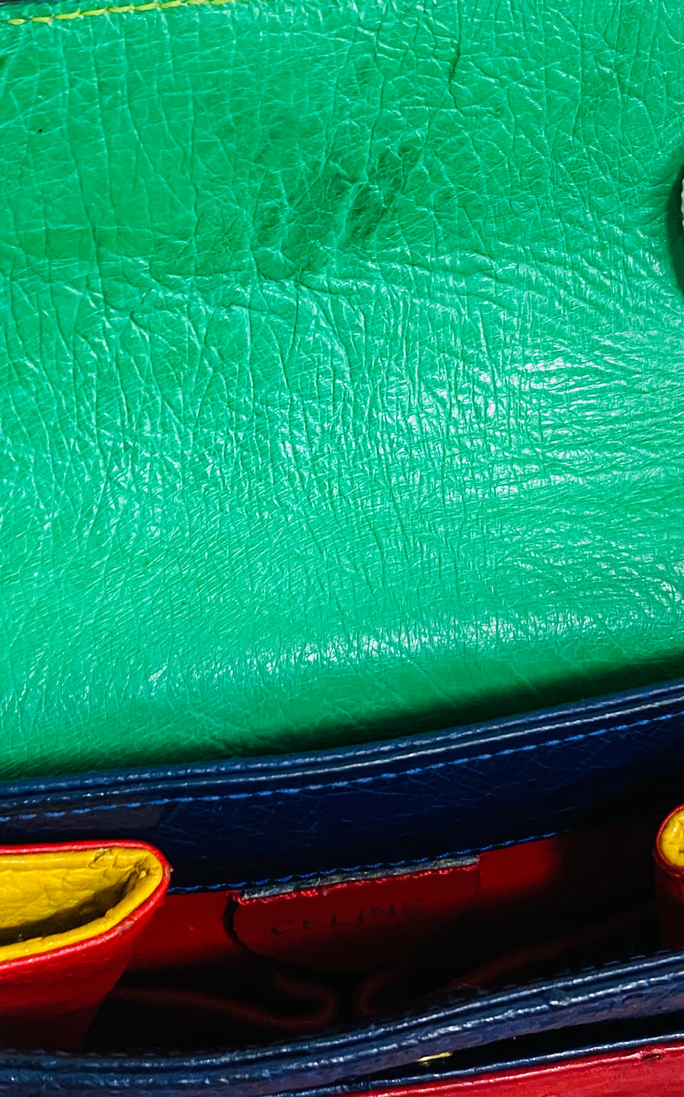 Vintage Celine genuine ostrich shoulder bag with gold tone chains and red, orange, blue, green, and yellow patchwork design. 050410ac1