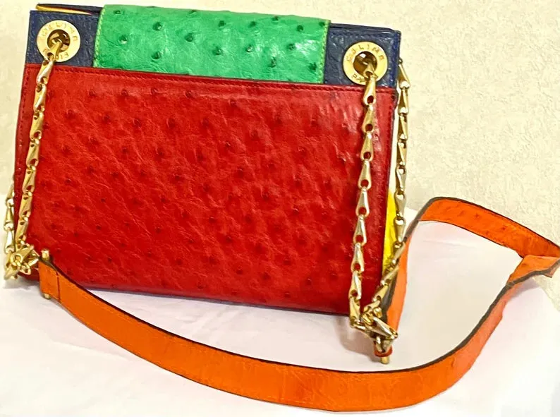 Vintage Celine genuine ostrich shoulder bag with gold tone chains and red, orange, blue, green, and yellow patchwork design. 050410ac1