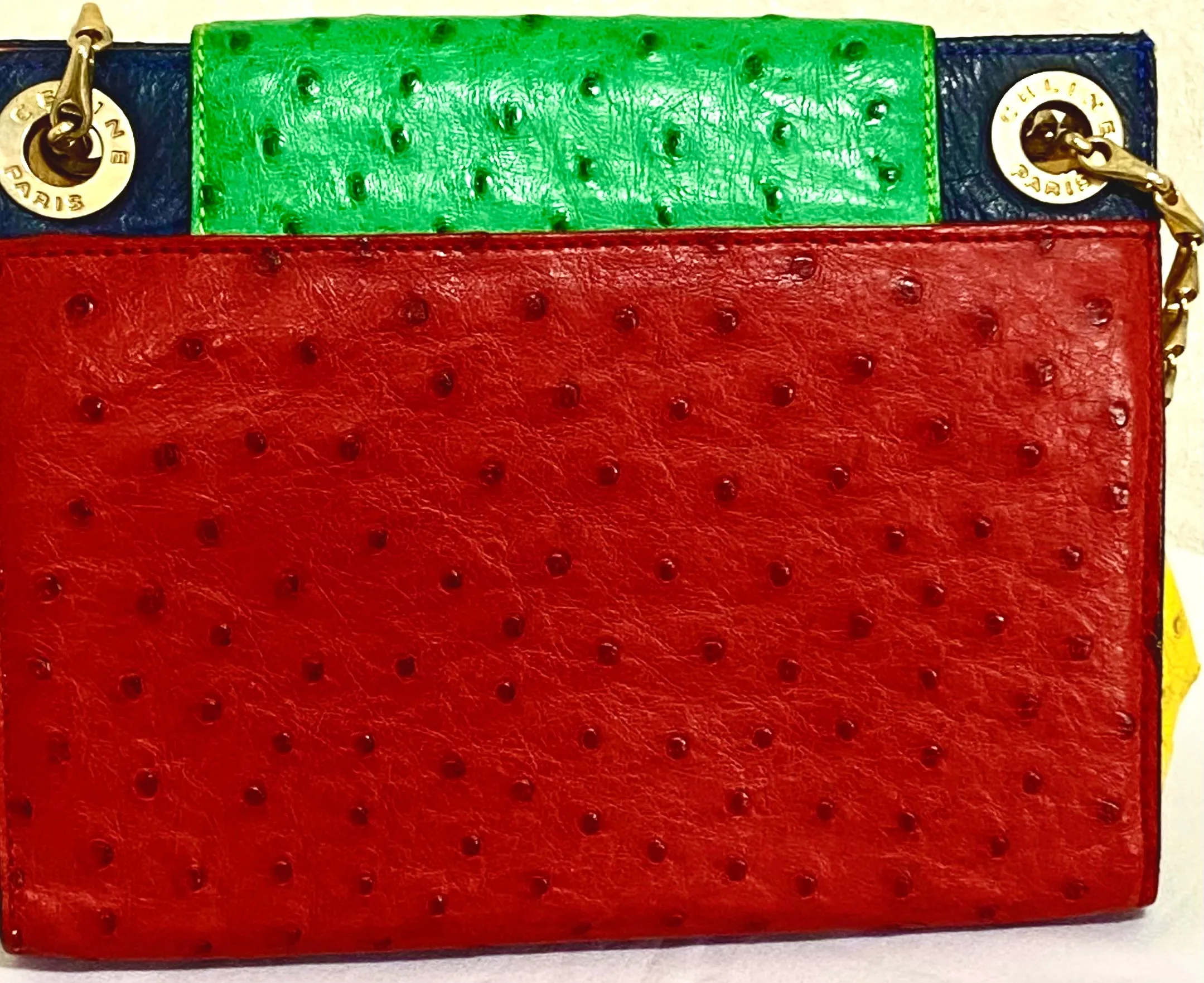Vintage Celine genuine ostrich shoulder bag with gold tone chains and red, orange, blue, green, and yellow patchwork design. 050410ac1