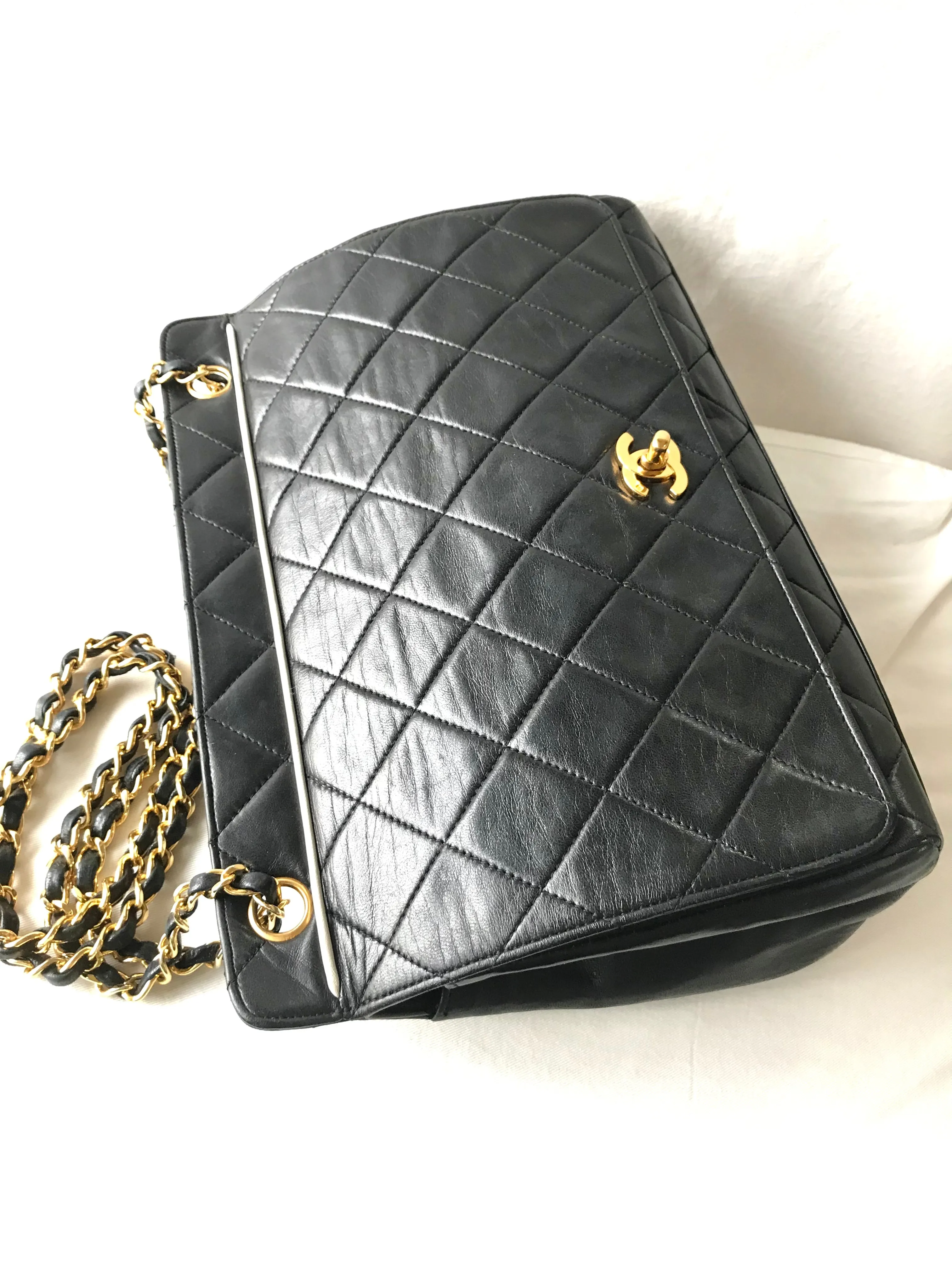 Vintage Chanel black leather 2.55 chain large shoulder bag with white trimming edge and a matching pouch. 0403284