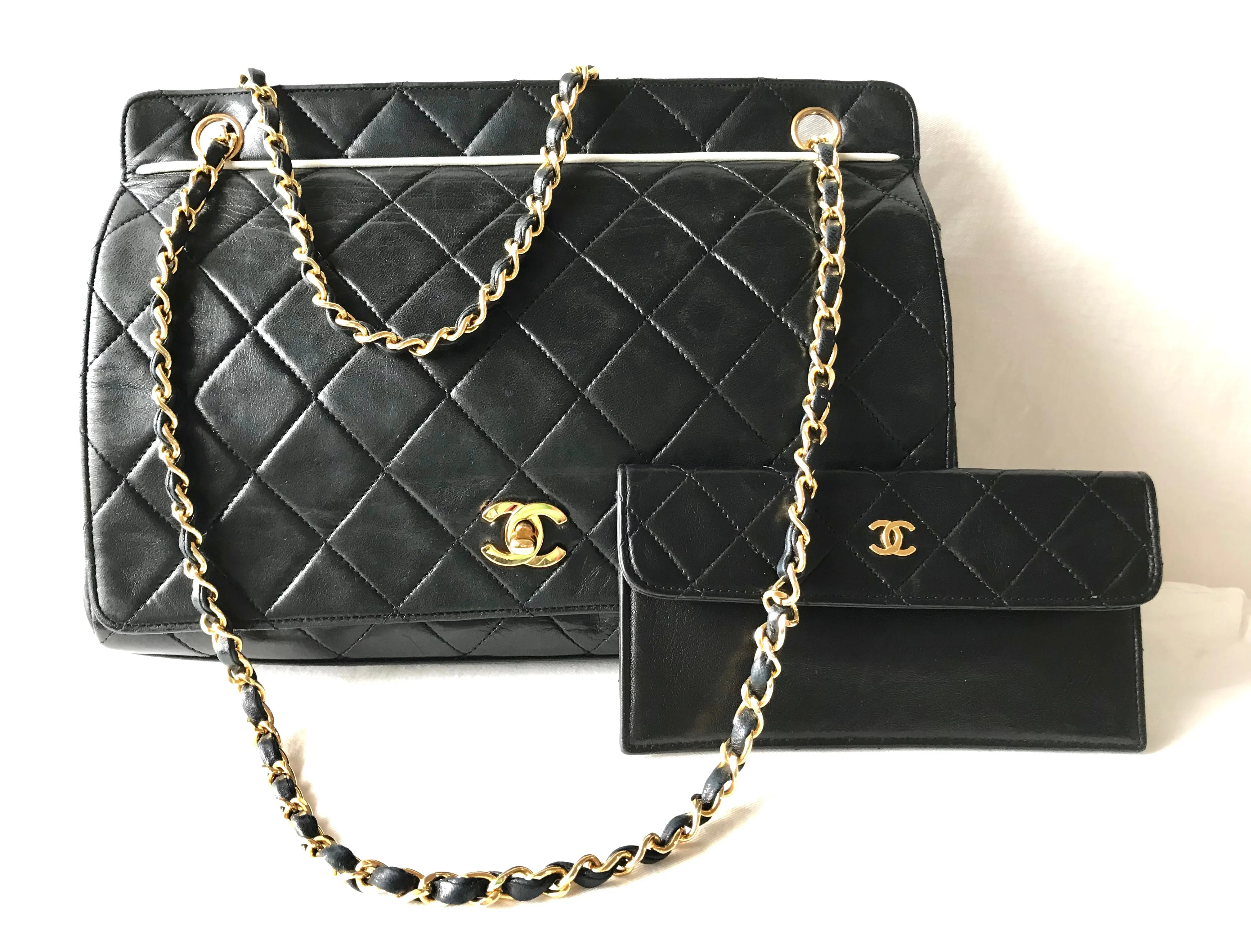 Vintage Chanel black leather 2.55 chain large shoulder bag with white trimming edge and a matching pouch. 0403284