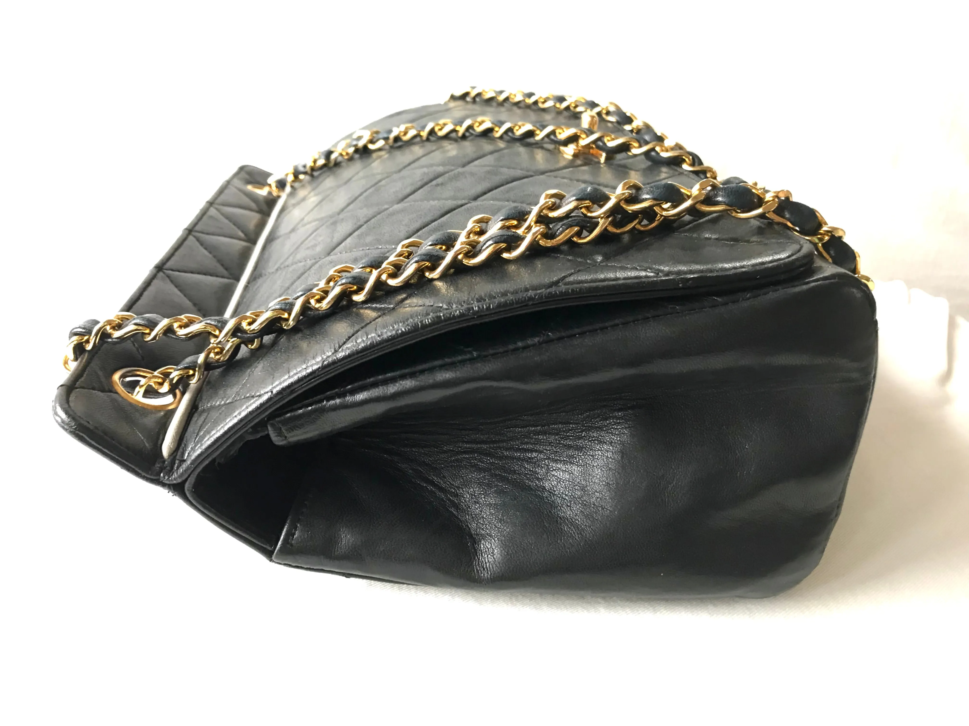 Vintage Chanel black leather 2.55 chain large shoulder bag with white trimming edge and a matching pouch. 0403284