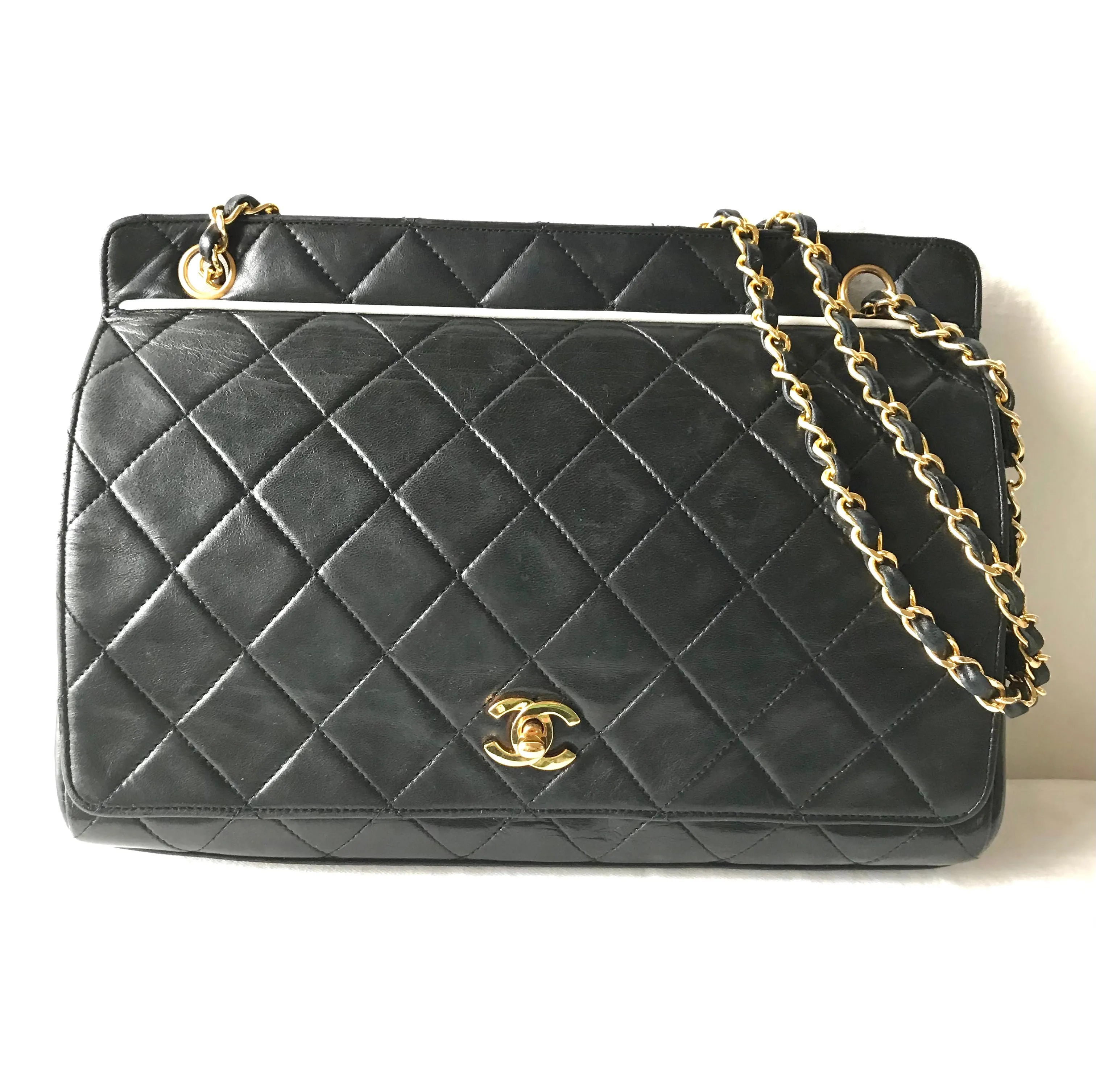Vintage Chanel black leather 2.55 chain large shoulder bag with white trimming edge and a matching pouch. 0403284