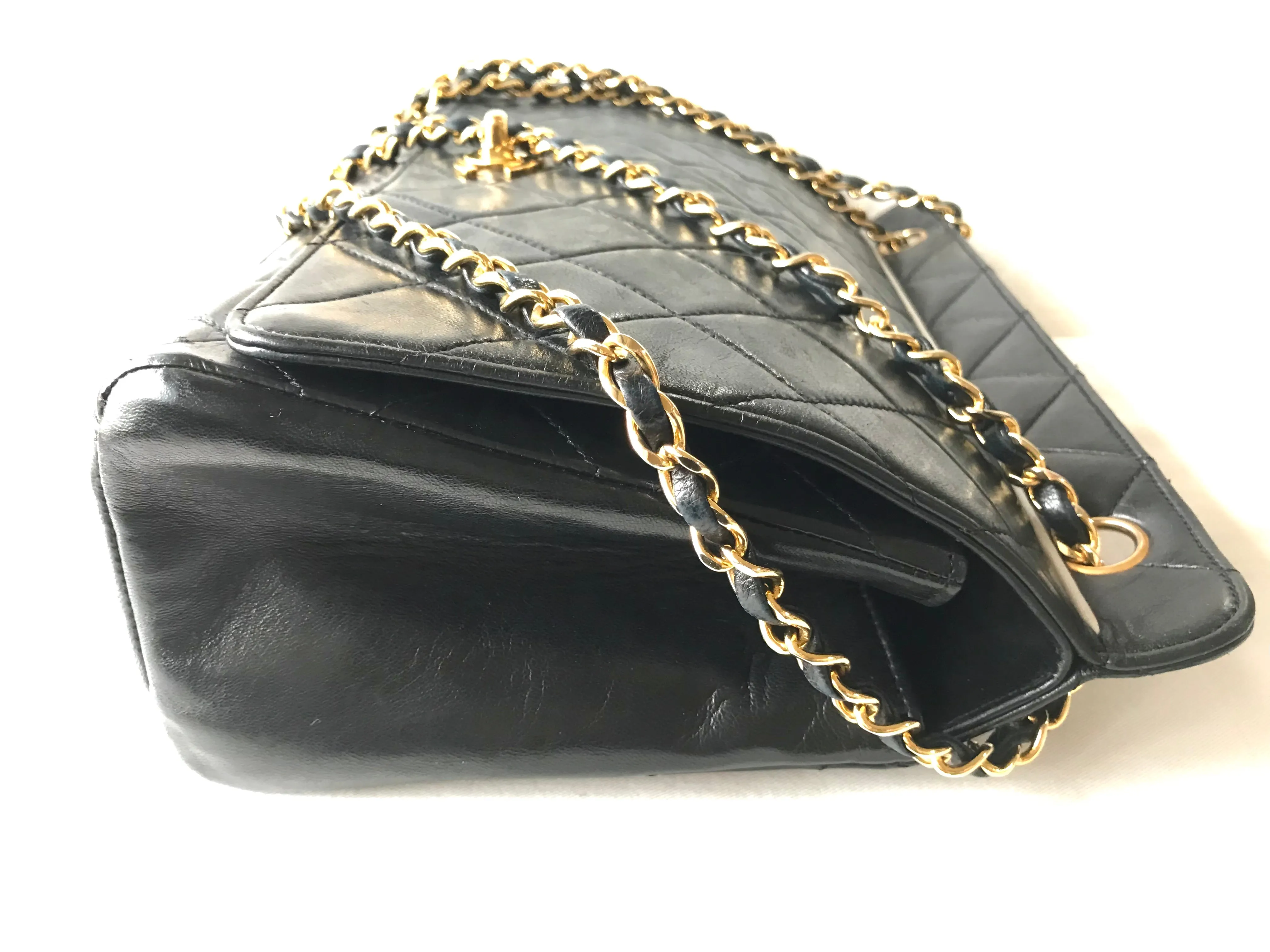 Vintage Chanel black leather 2.55 chain large shoulder bag with white trimming edge and a matching pouch. 0403284