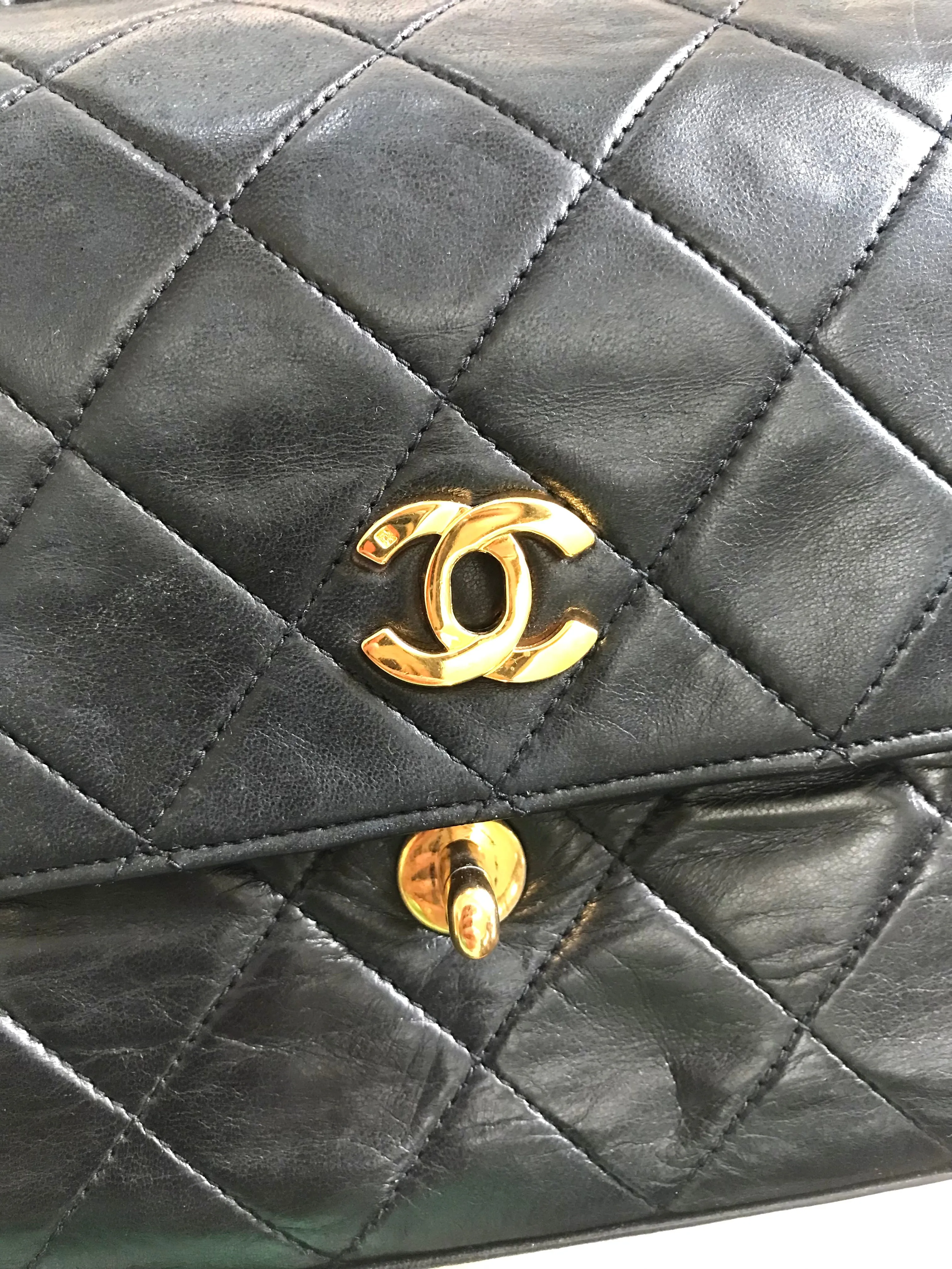Vintage Chanel black leather 2.55 chain large shoulder bag with white trimming edge and a matching pouch. 0403284