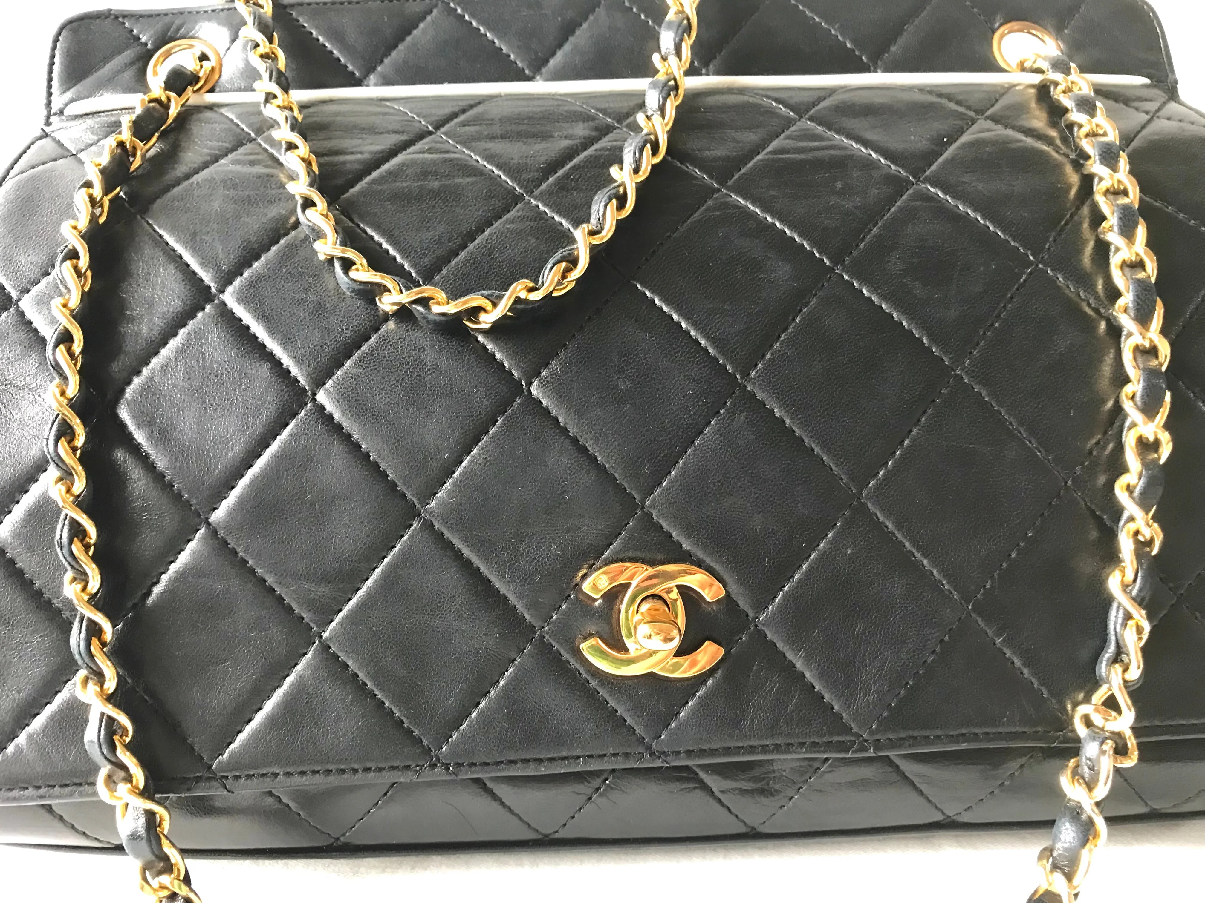 Vintage Chanel black leather 2.55 chain large shoulder bag with white trimming edge and a matching pouch. 0403284