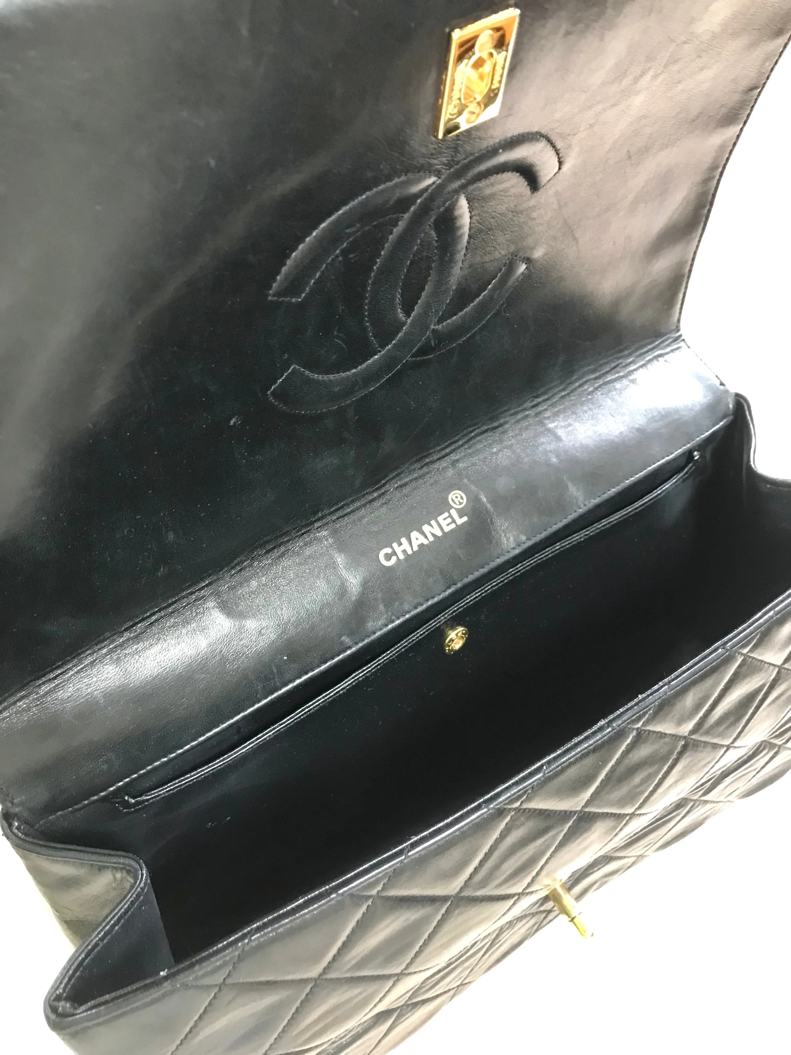 Vintage Chanel black leather 2.55 chain large shoulder bag with white trimming edge and a matching pouch. 0403284