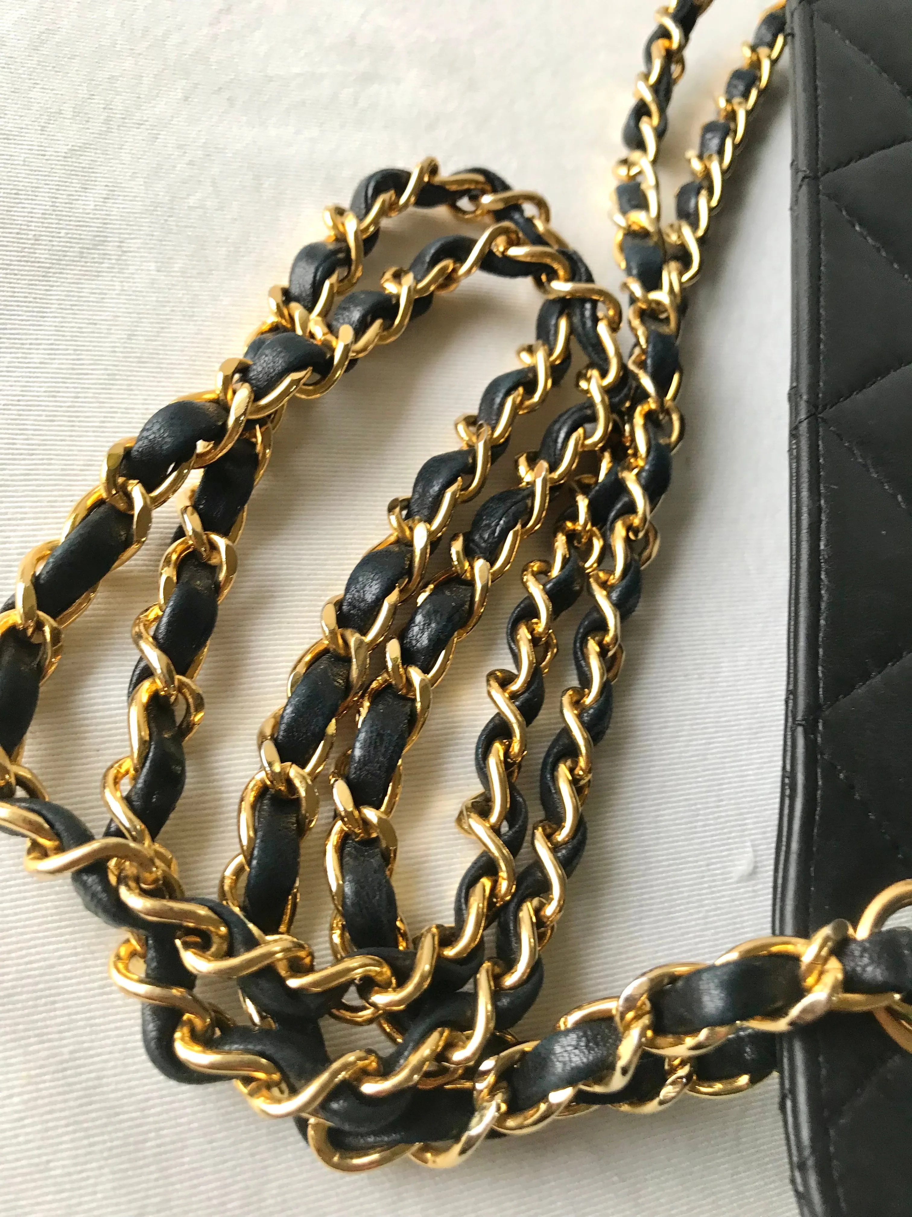 Vintage Chanel black leather 2.55 chain large shoulder bag with white trimming edge and a matching pouch. 0403284