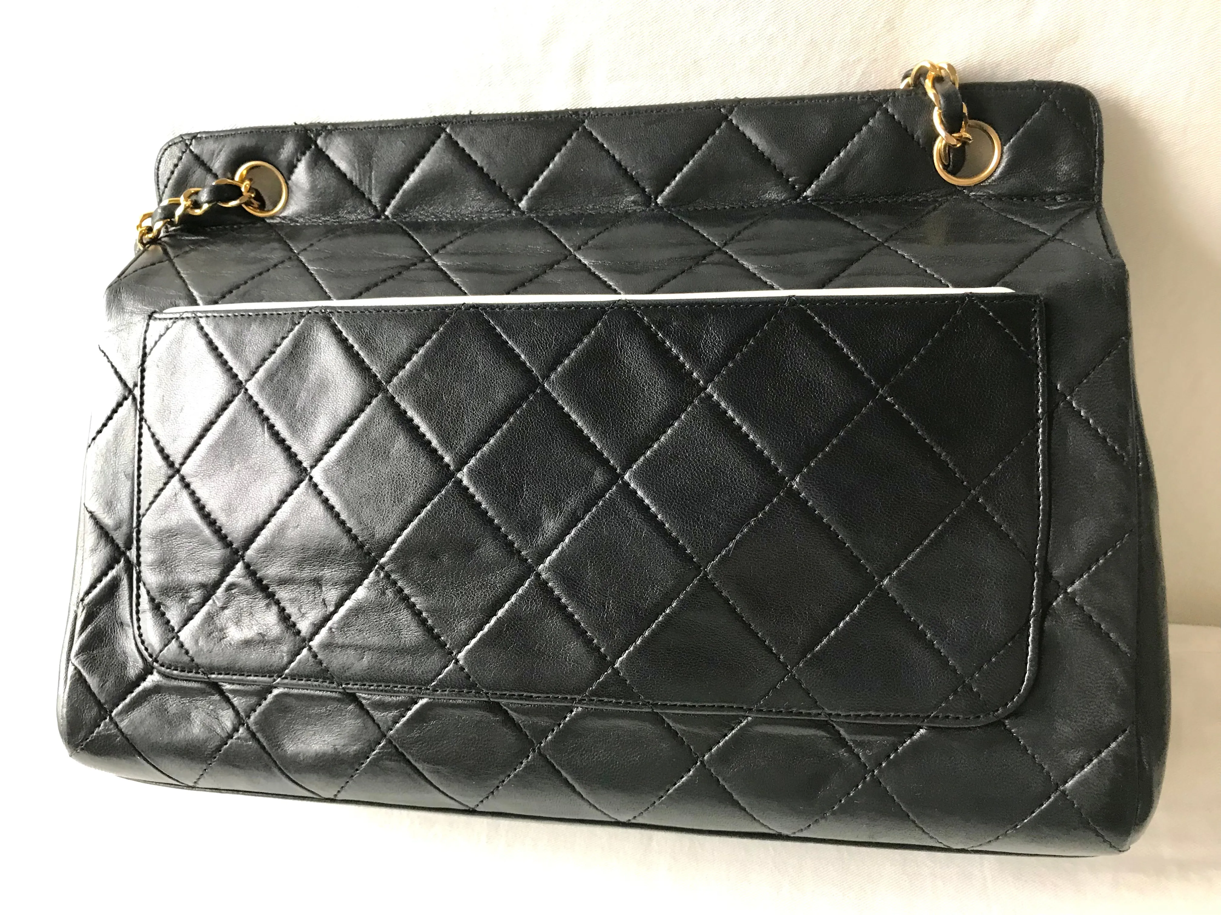Vintage Chanel black leather 2.55 chain large shoulder bag with white trimming edge and a matching pouch. 0403284