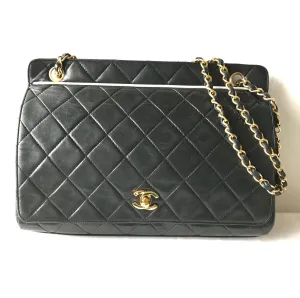 Vintage Chanel black leather 2.55 chain large shoulder bag with white trimming edge and a matching pouch. 0403284