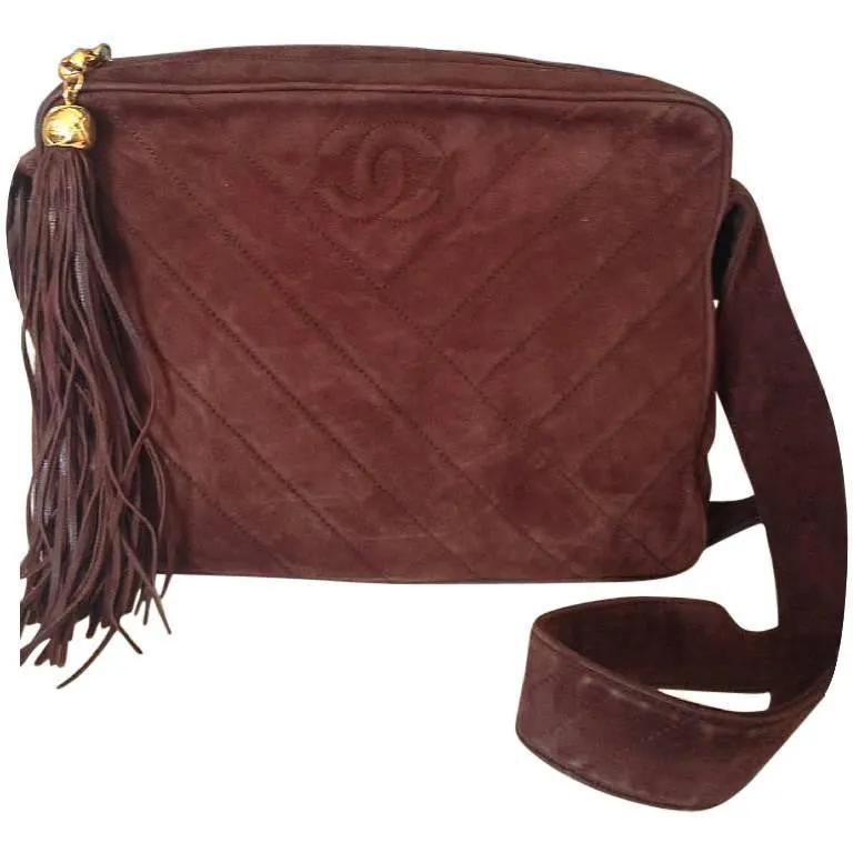 Vintage CHANEL dark brown V stitch suede leather shoulder bag with CC stitch mark and long tassel. Best Chanel purse for fall and winter.