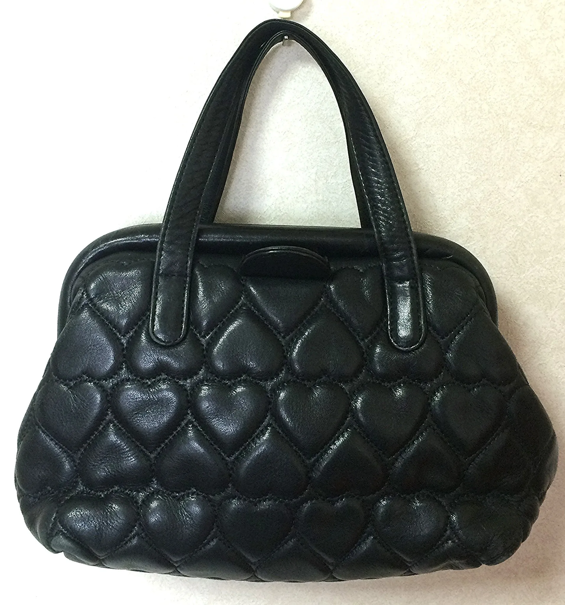 Vintage MOSCHINO black heart shape quilted lambskin mini handbag, tote purse. Too cute to carry.