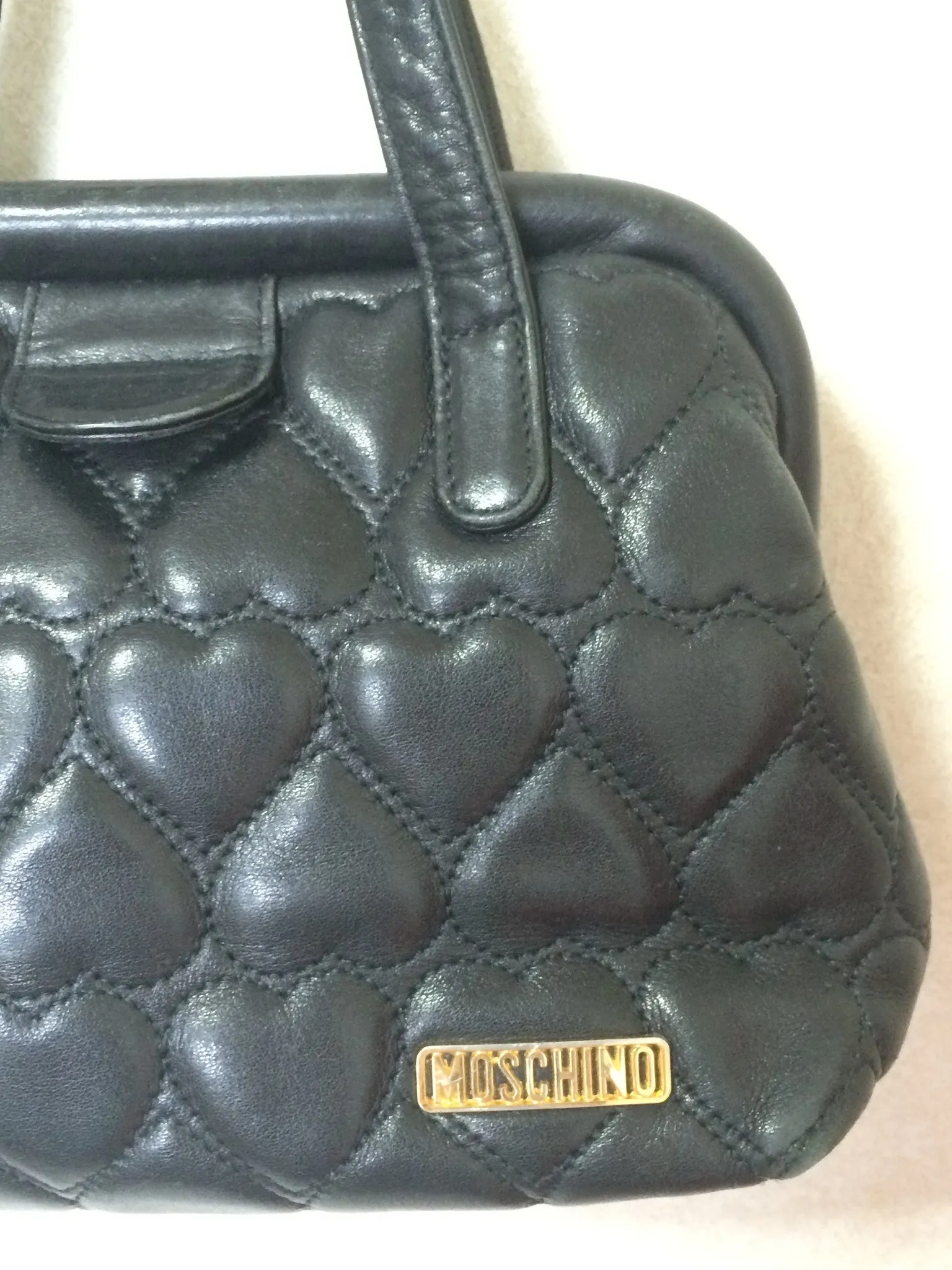 Vintage MOSCHINO black heart shape quilted lambskin mini handbag, tote purse. Too cute to carry.