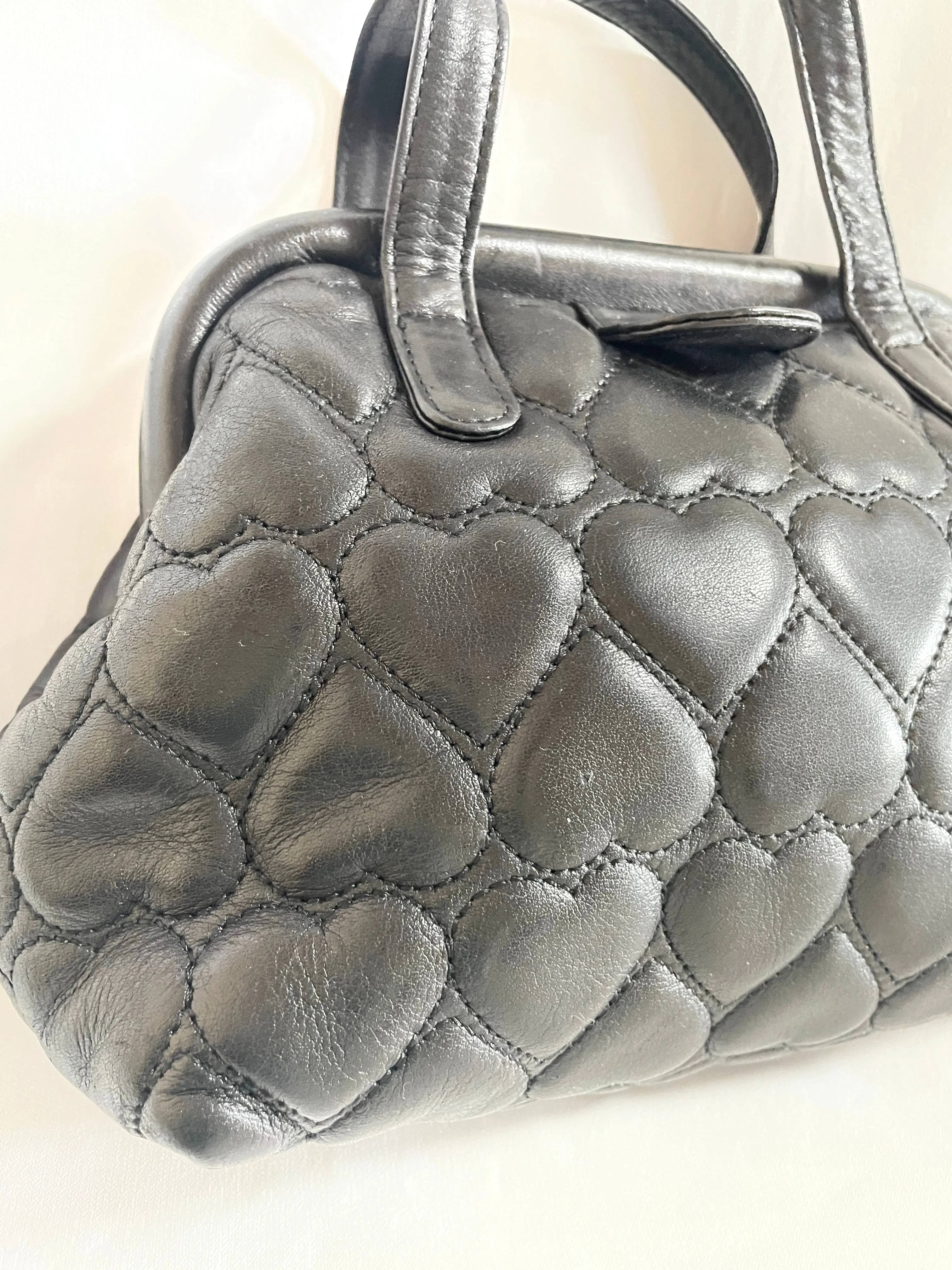 Vintage MOSCHINO black heart shape quilted lambskin mini handbag, tote purse. Too cute to carry.