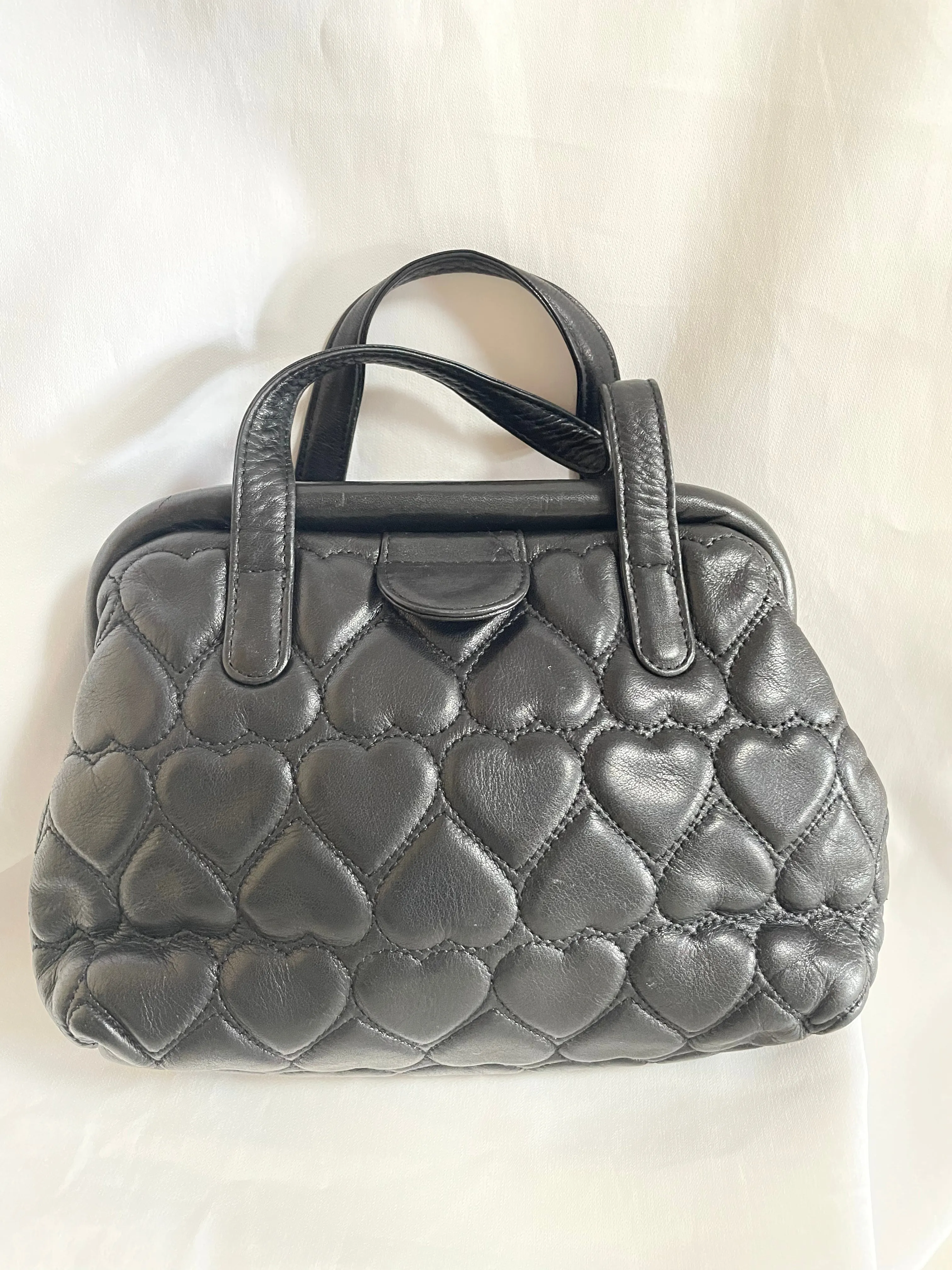 Vintage MOSCHINO black heart shape quilted lambskin mini handbag, tote purse. Too cute to carry.