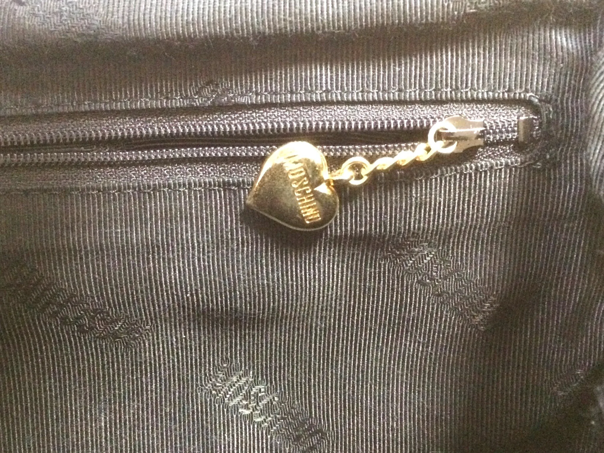 Vintage MOSCHINO black heart shape quilted lambskin mini handbag, tote purse. Too cute to carry.