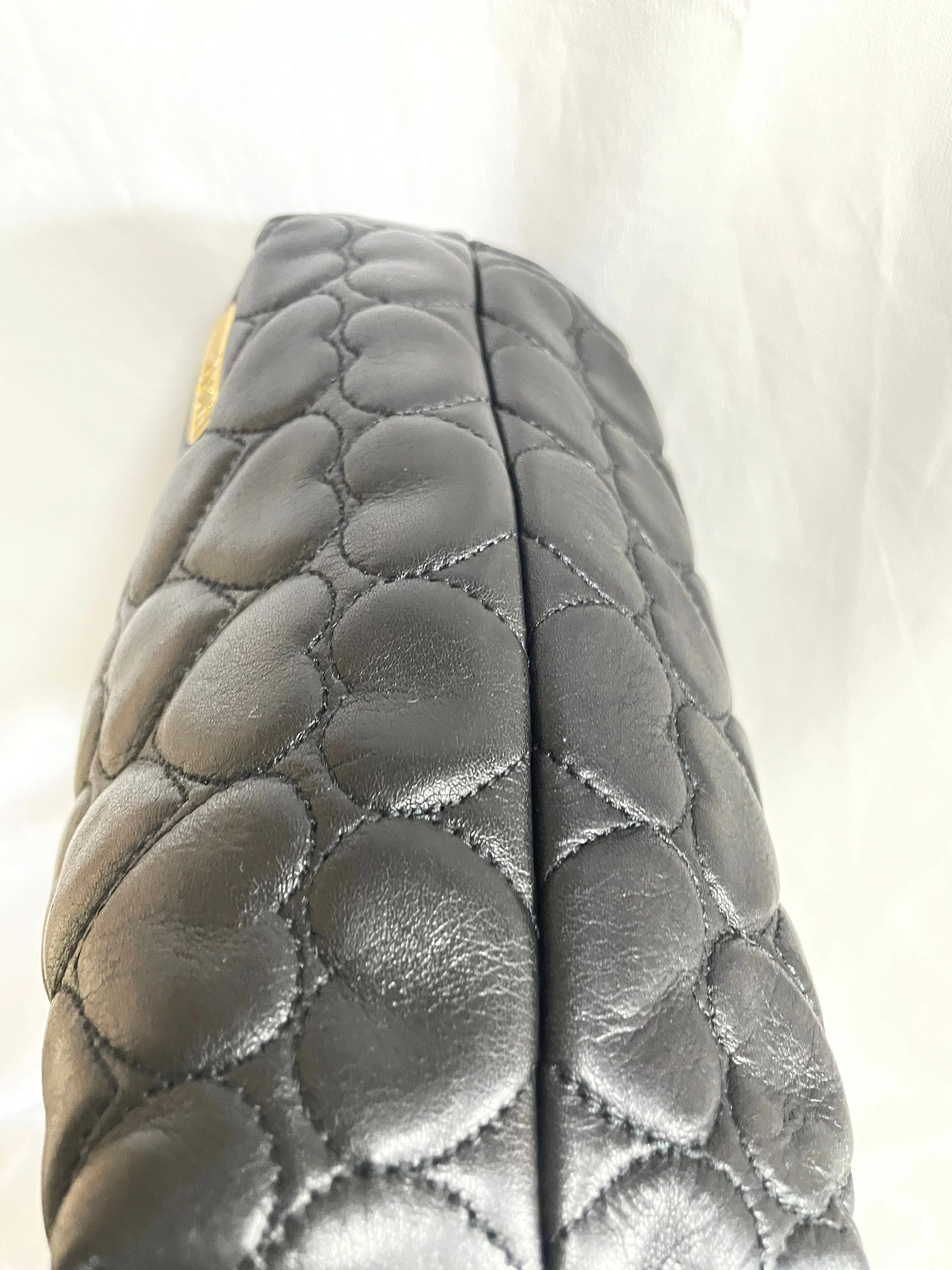 Vintage MOSCHINO black heart shape quilted lambskin mini handbag, tote purse. Too cute to carry.