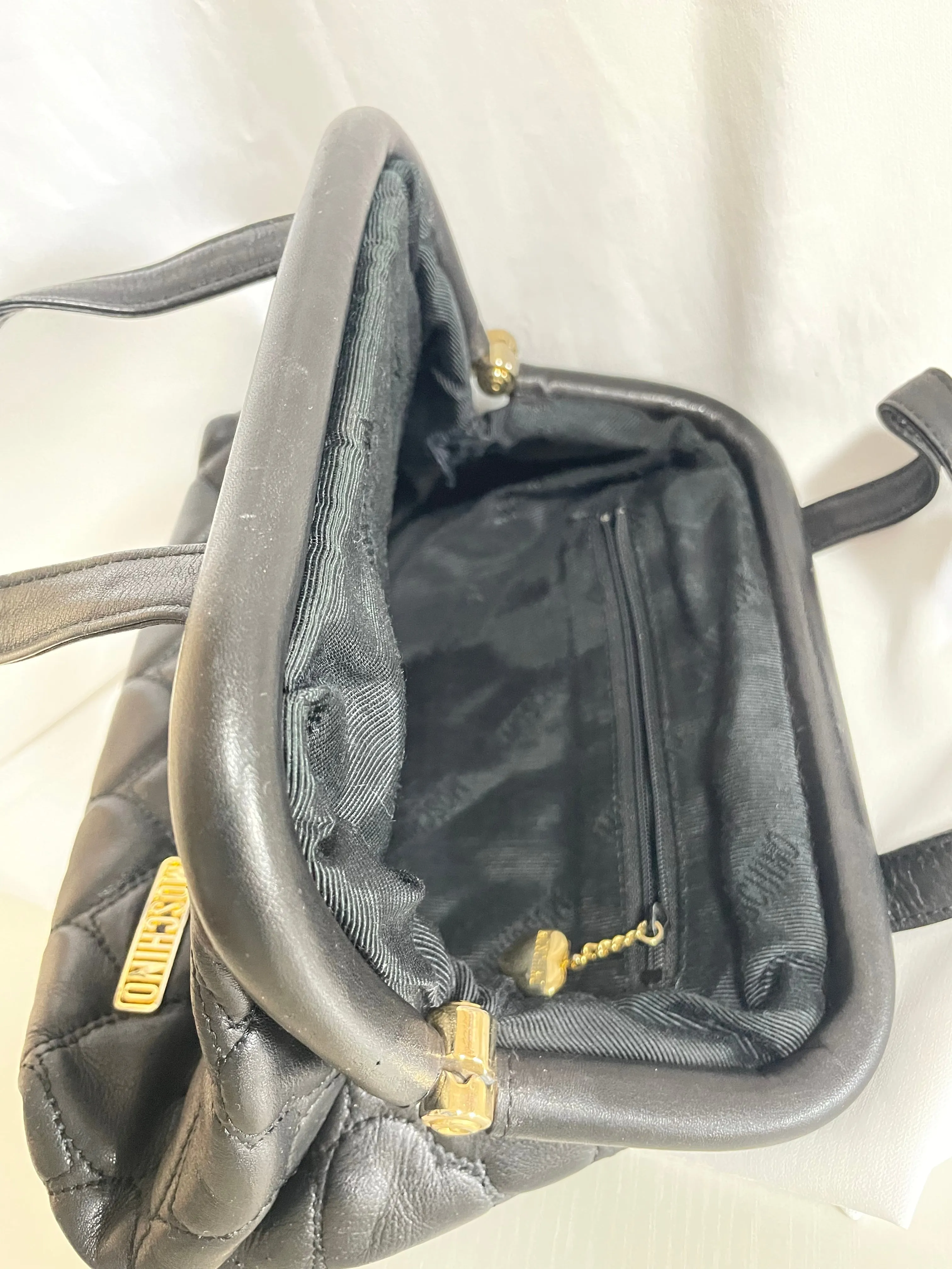 Vintage MOSCHINO black heart shape quilted lambskin mini handbag, tote purse. Too cute to carry.