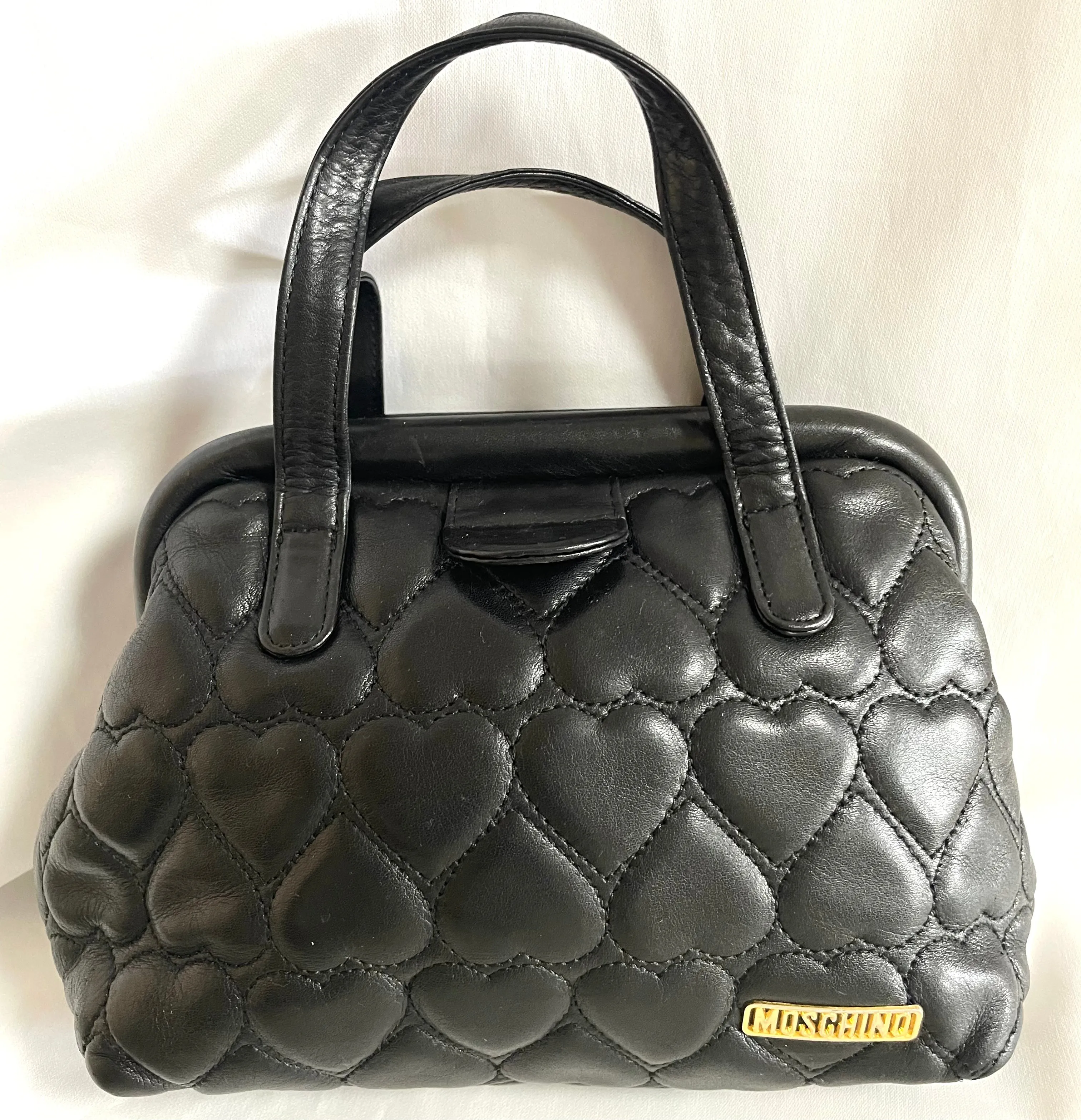 Vintage MOSCHINO black heart shape quilted lambskin mini handbag, tote purse. Too cute to carry.