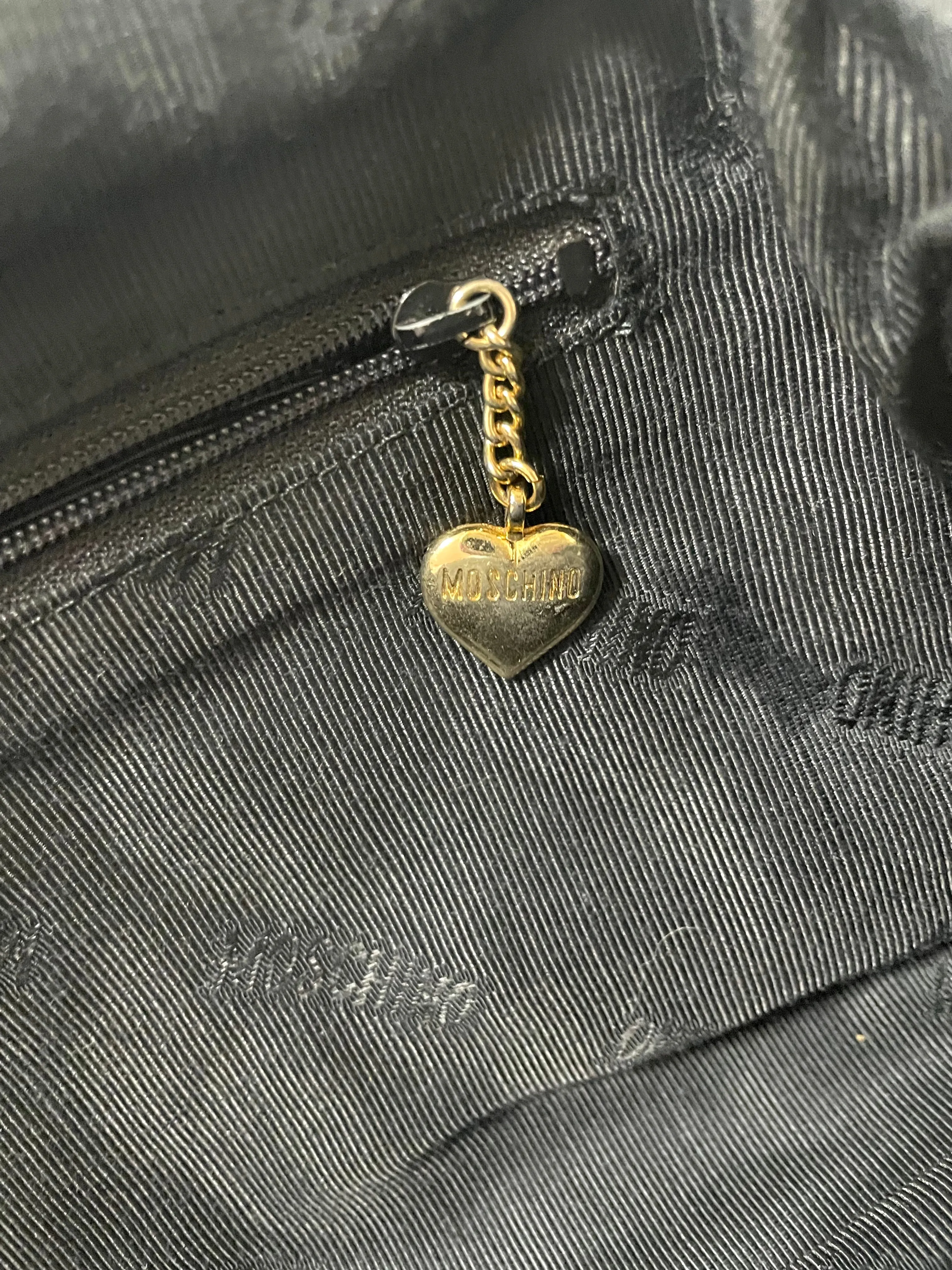 Vintage MOSCHINO black heart shape quilted lambskin mini handbag, tote purse. Too cute to carry.