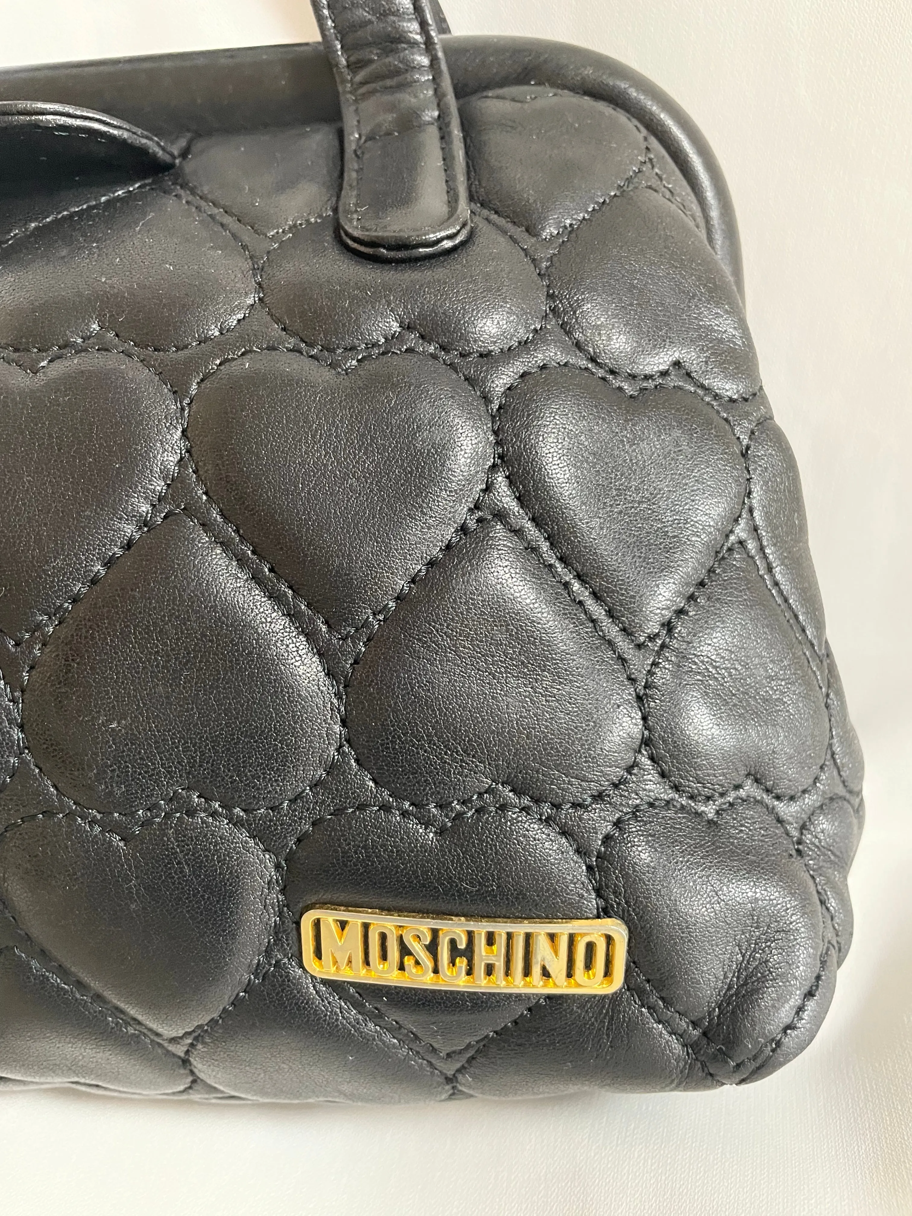 Vintage MOSCHINO black heart shape quilted lambskin mini handbag, tote purse. Too cute to carry.