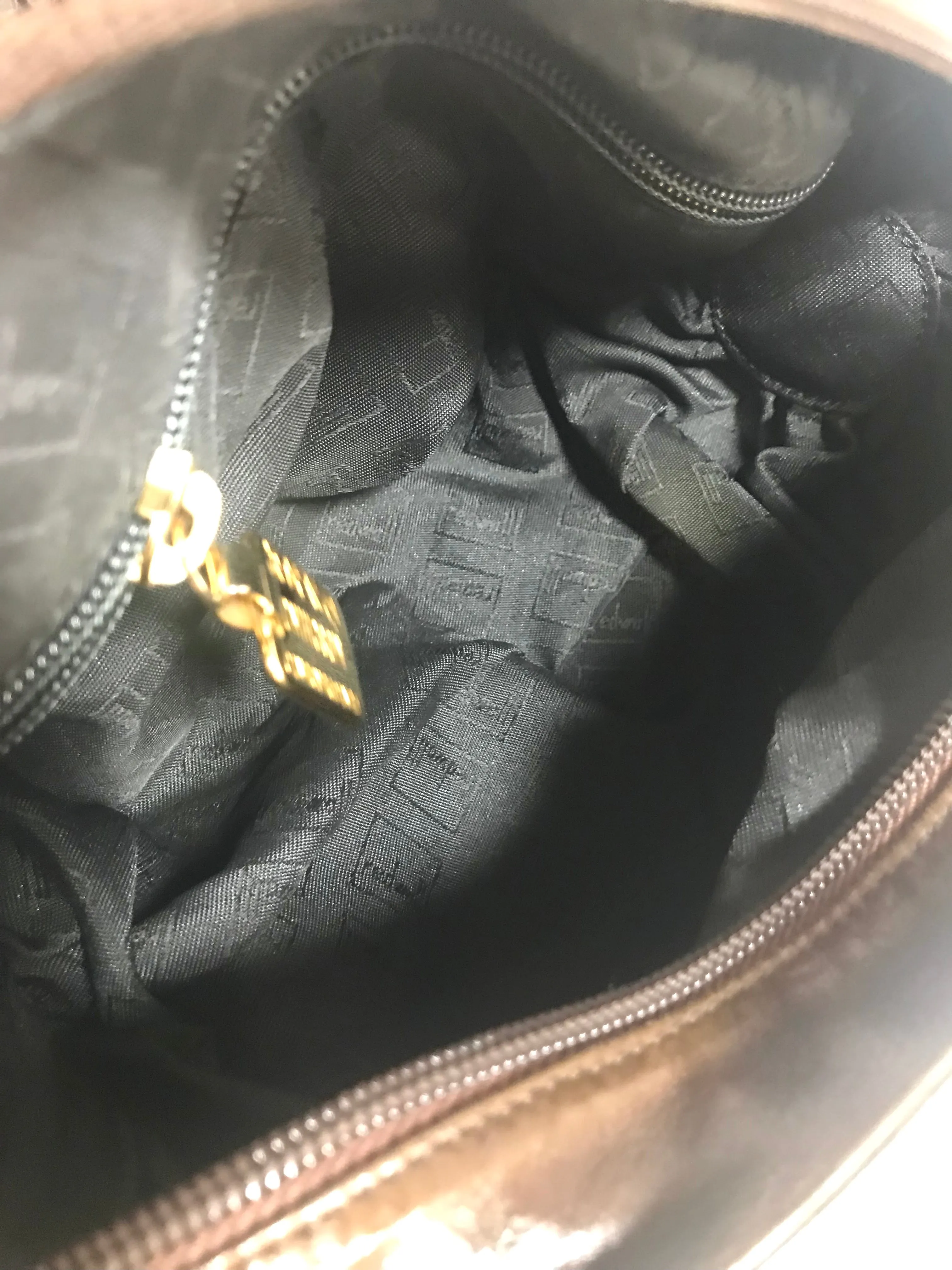 Vintage Moschino soft brown leather drum shape shoulder bag with iconic Question marks. Moschino by Redwall. Made in Italy. 060724r1 Moschino by Redwall. Made in Italy.