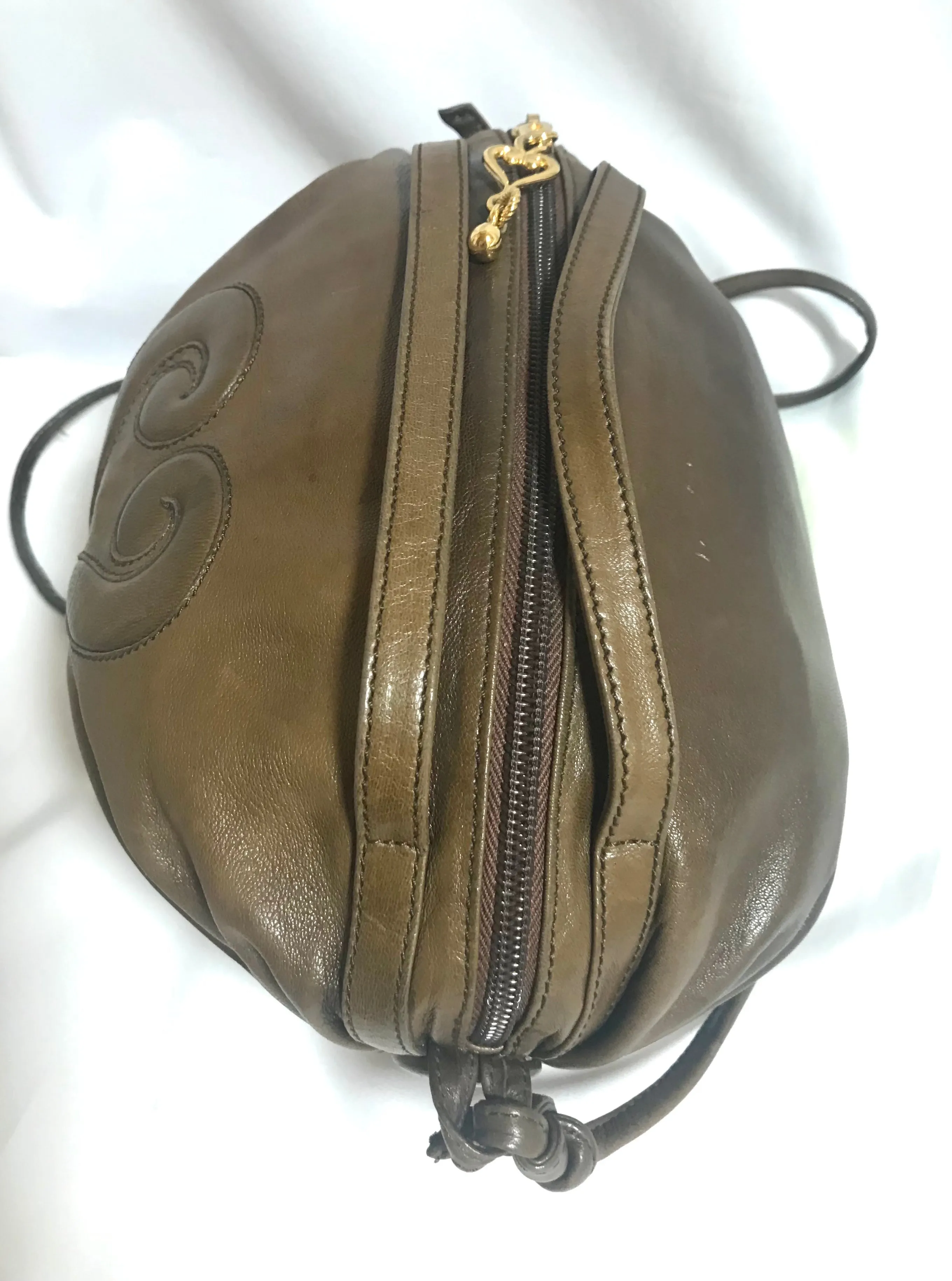 Vintage Moschino soft brown leather drum shape shoulder bag with iconic Question marks. Moschino by Redwall. Made in Italy. 060724r1 Moschino by Redwall. Made in Italy.