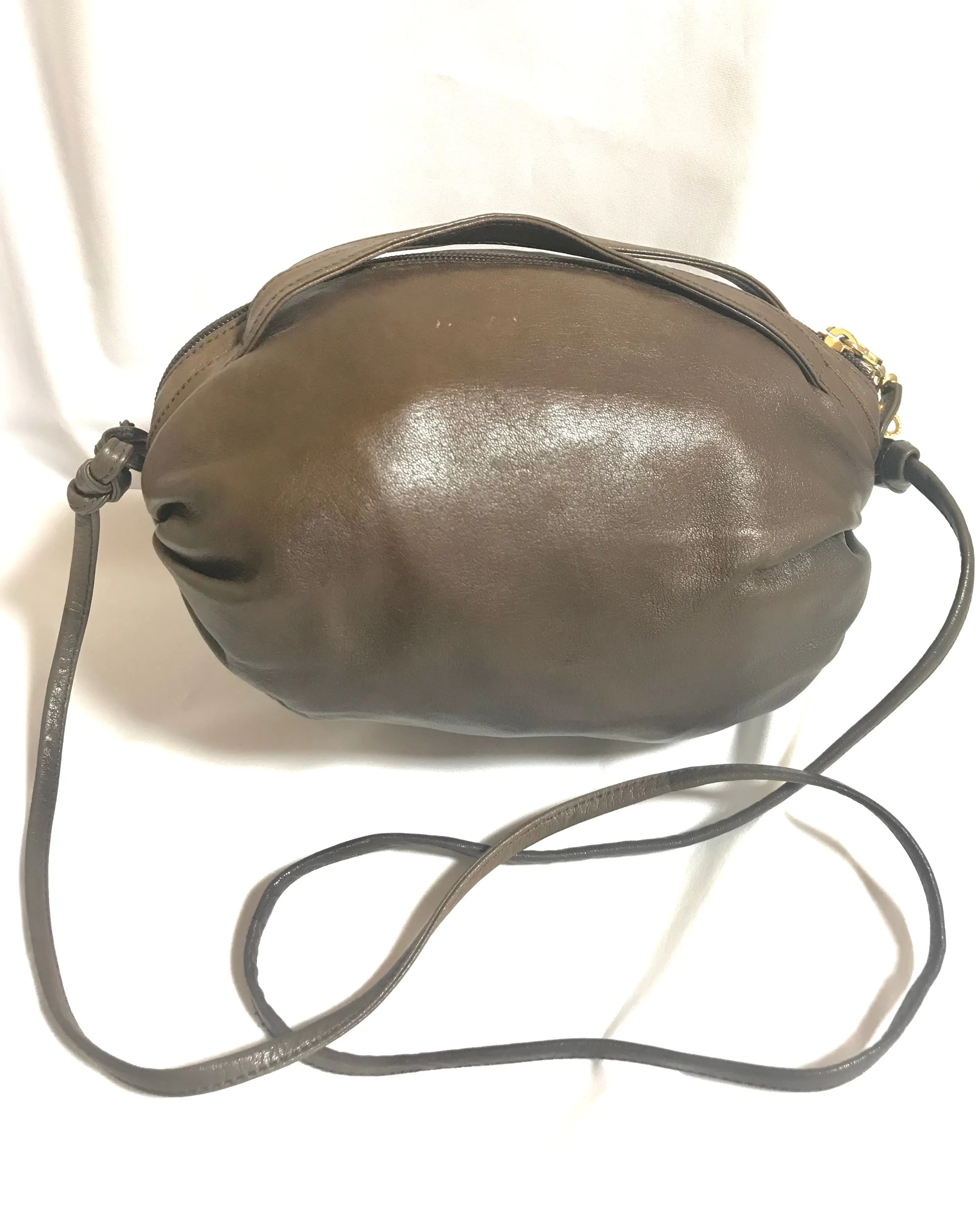 Vintage Moschino soft brown leather drum shape shoulder bag with iconic Question marks. Moschino by Redwall. Made in Italy. 060724r1 Moschino by Redwall. Made in Italy.
