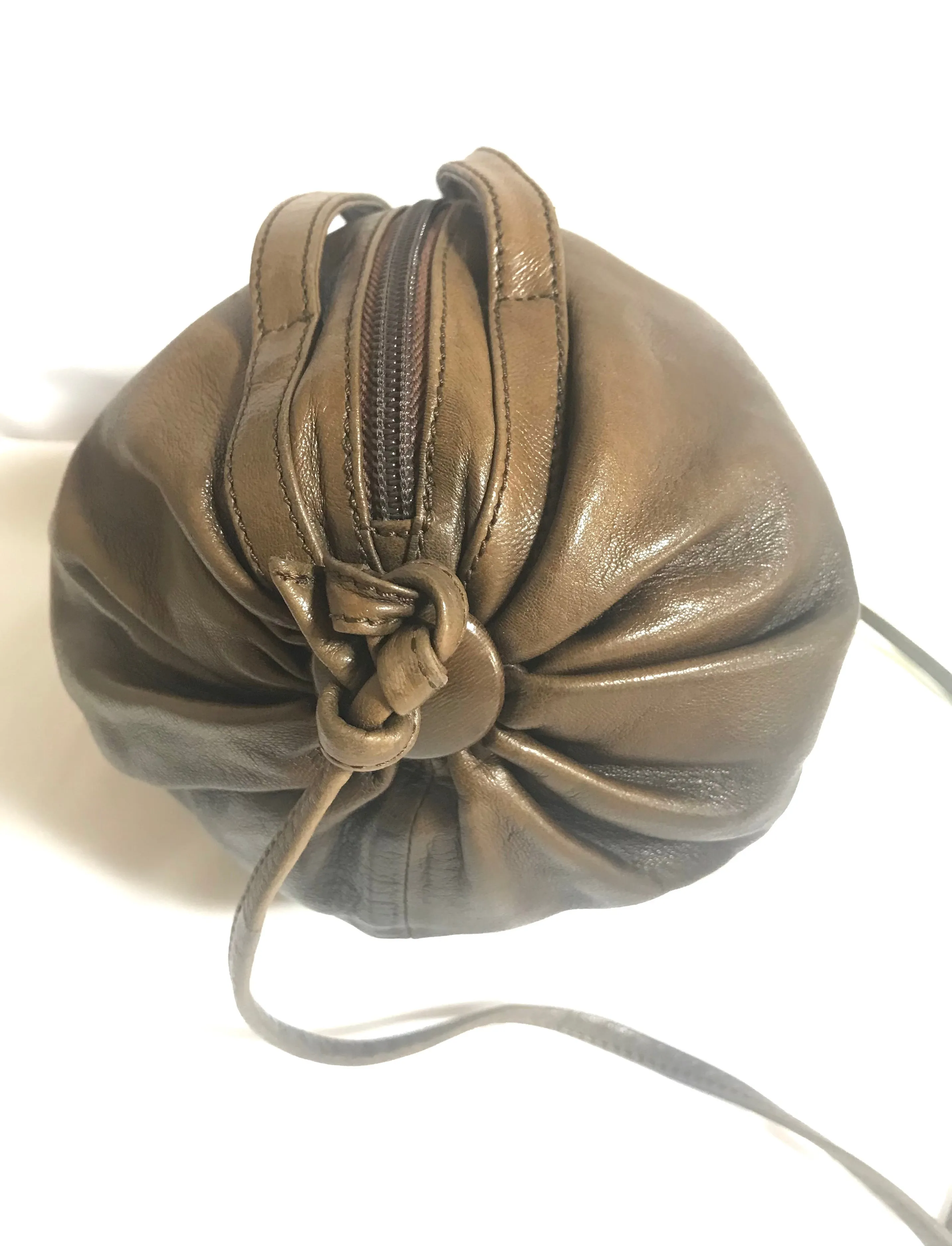 Vintage Moschino soft brown leather drum shape shoulder bag with iconic Question marks. Moschino by Redwall. Made in Italy. 060724r1 Moschino by Redwall. Made in Italy.